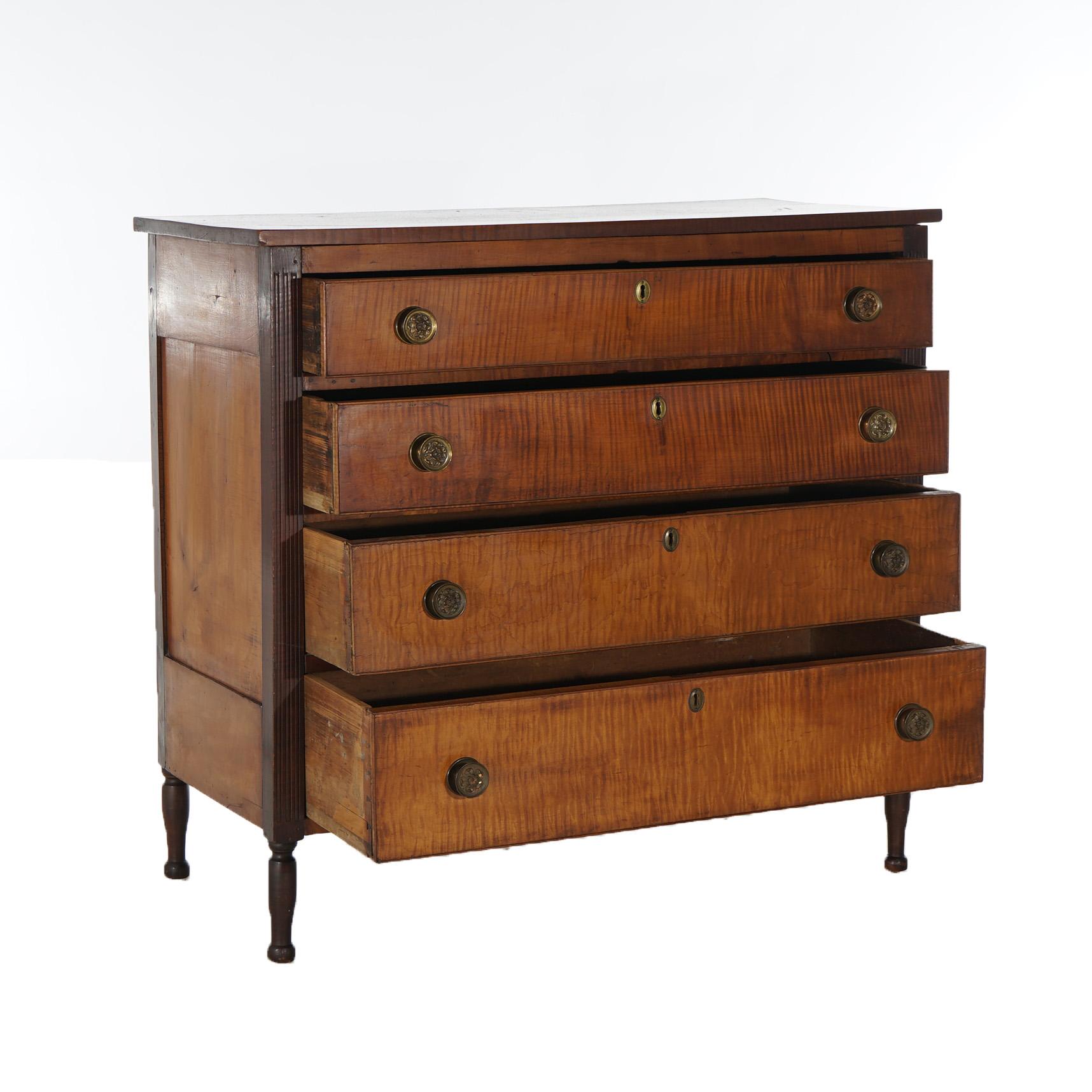An antique Sheridan chest of drawers offers tiger maple construction with four graduated long drawers flanked by reeded columns, raised on turned legs, c1870

Measures - 39
