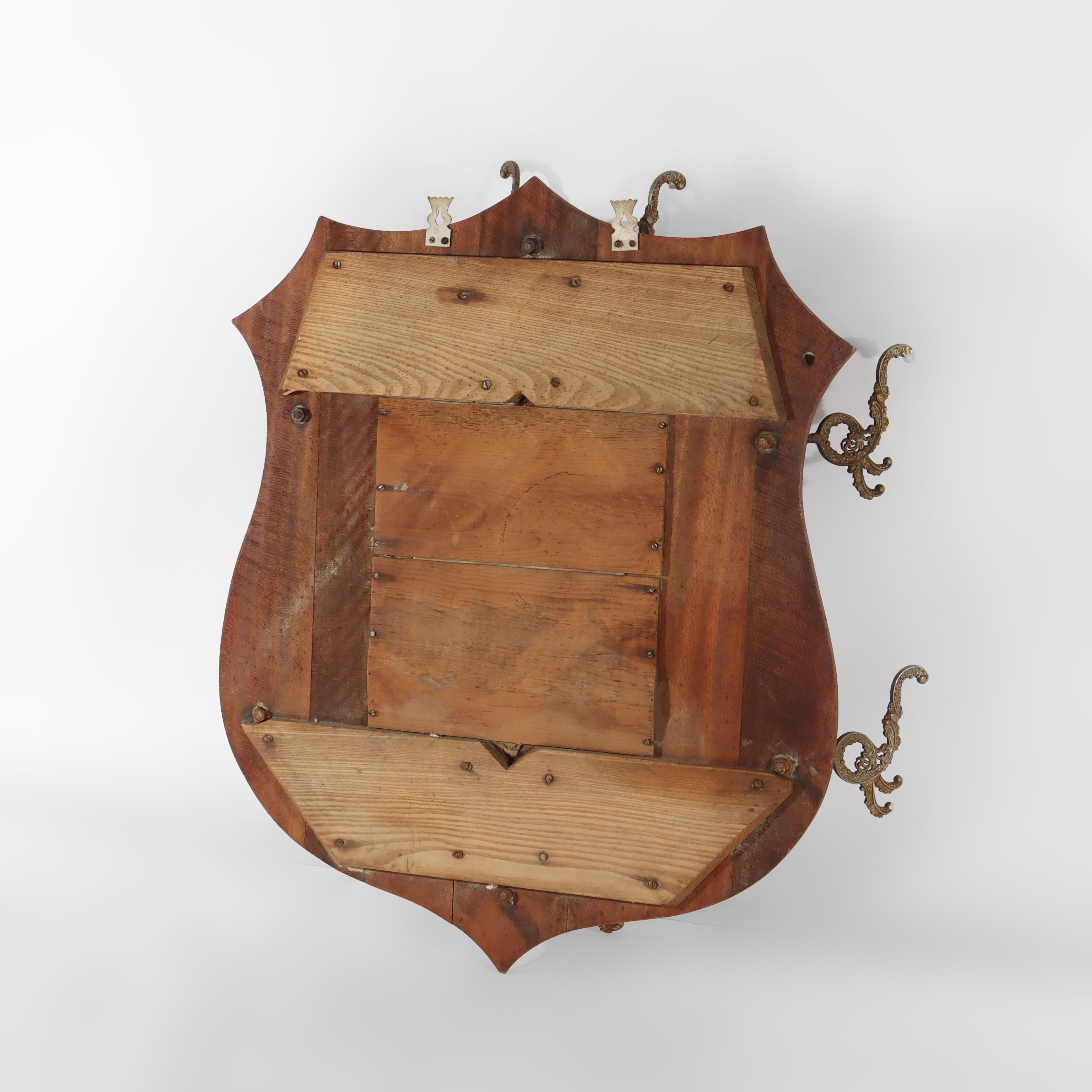 Antique Shield Form Walnut Mirrored Hat Rack With Six Hooks c1890 In Good Condition For Sale In Big Flats, NY