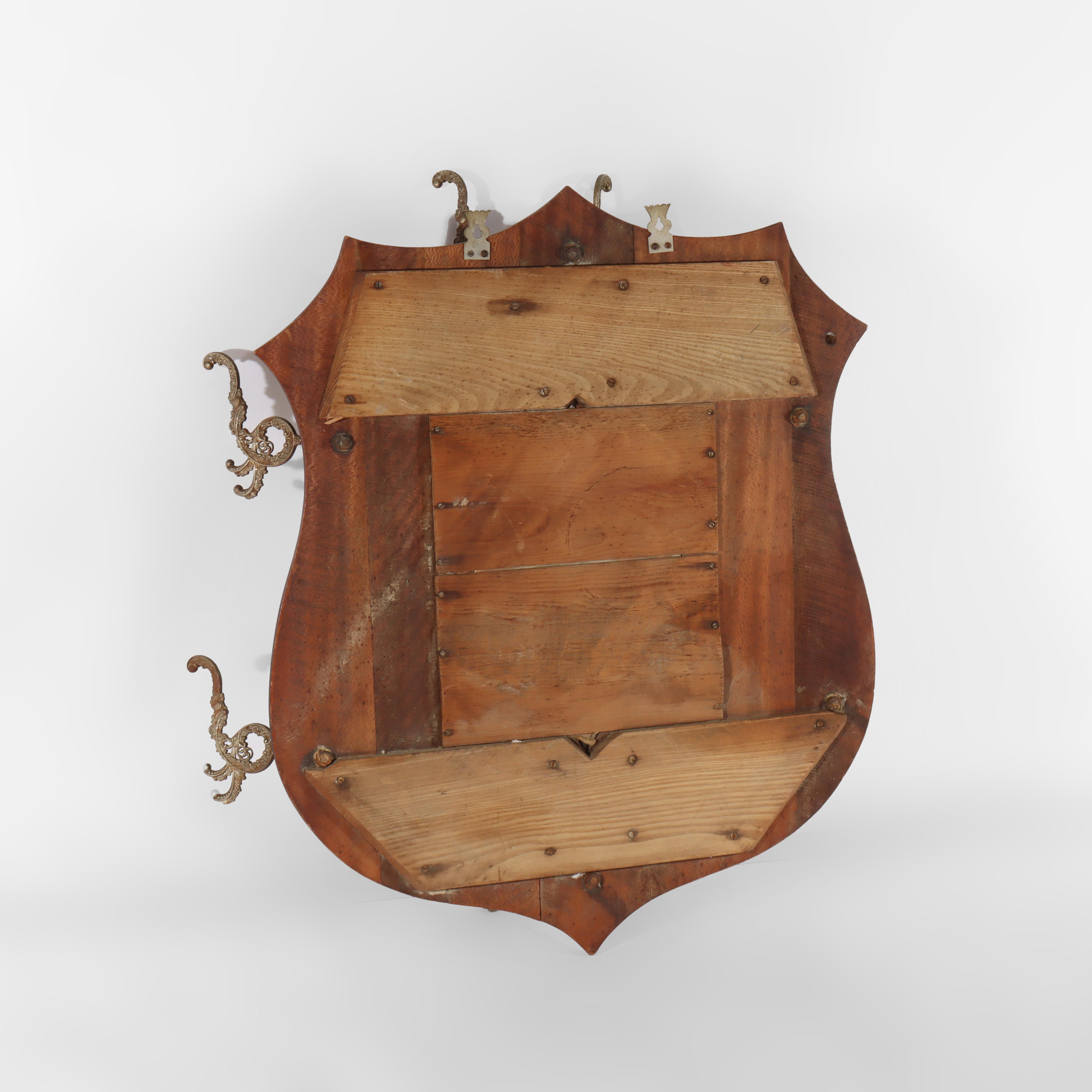 19th Century Antique Shield Form Walnut Mirrored Hat Rack With Six Hooks c1890 For Sale