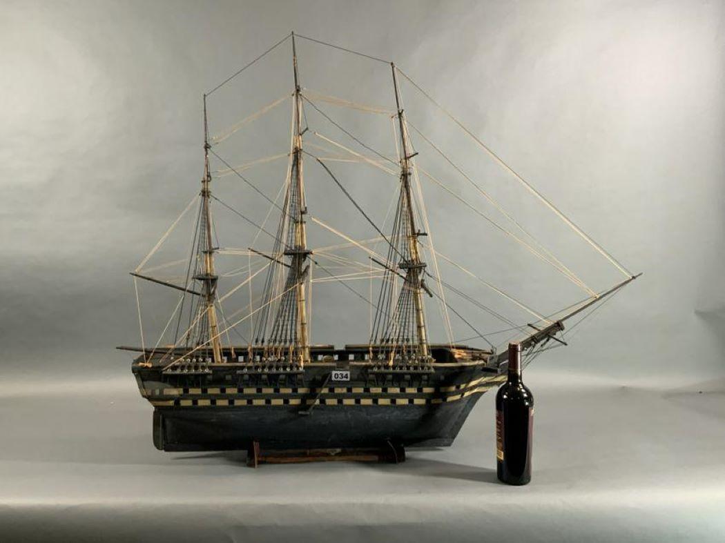 Antique nineteenth century model of a three deck ship of the line. Rigged with standing and running rigging. Missing cannon. Weight is 13 pounds. 51