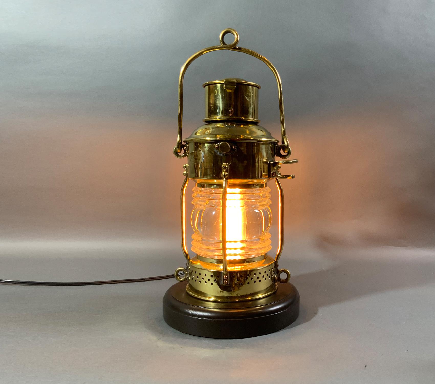 Antique solid brass ships anchor lantern with Fresnel glass lens, hinged top, carry handle, etc. with makers plate from Ouvrard Villars, a highly regarded maker. This is a first-class ship lantern that has been meticulously polished and lacquered.