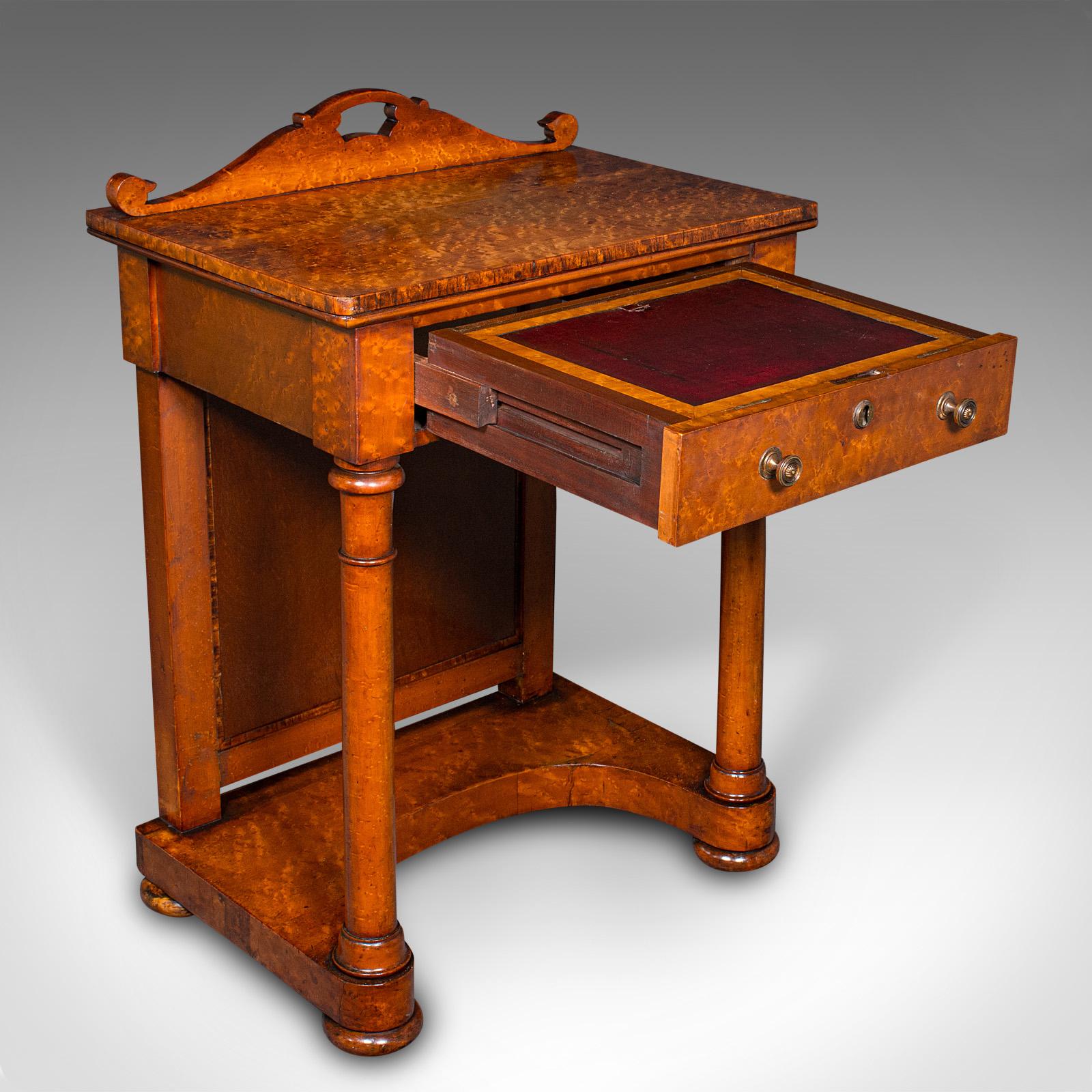 This is an antique ship's purser's desk. An English, burr walnut Davenport writing table in the Beidermeier taste, dating to the Victorian period, circa 1880.

Exquisite craftsmanship with superb colour and figuring
Displays a desirable aged patina
