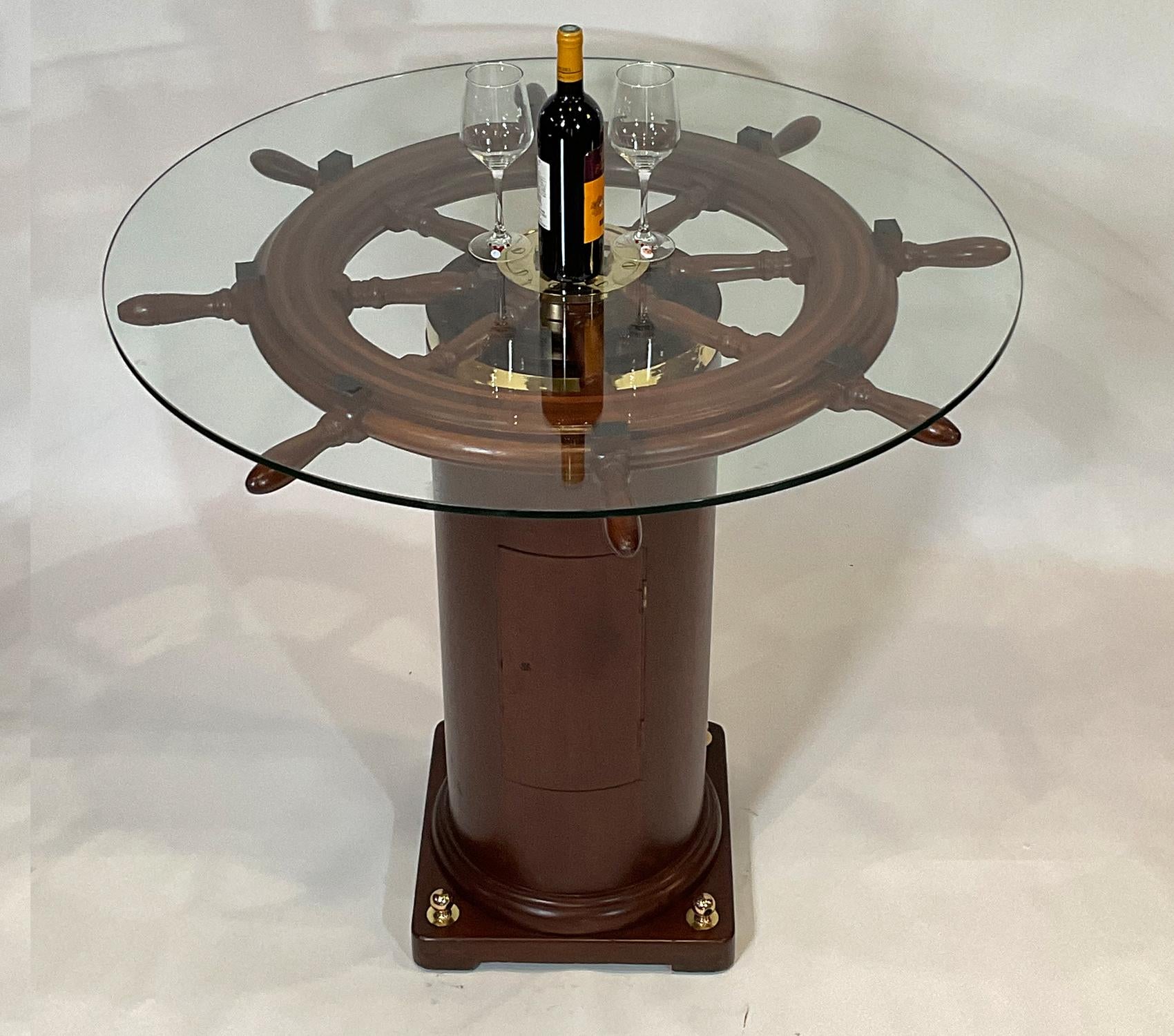 Quality eight spoke varnished ships wheel that is mounted to an authentic ships binnacle base. Both have been professionally sanded, stained, and refinished. The result is extraordinary. The brass hub has been meticulously polished and lacquered.