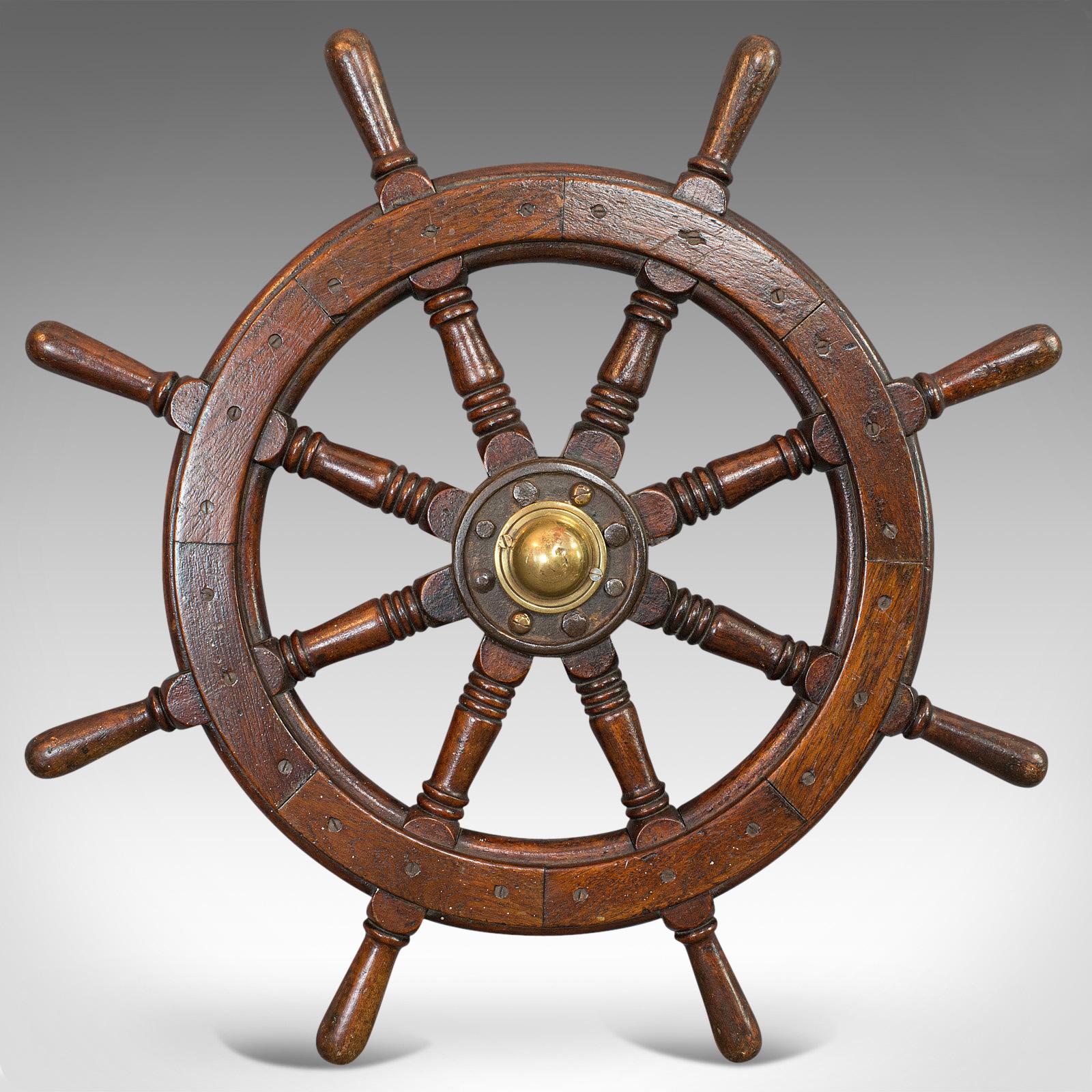 This is an antique ship's wheel. An English, oak and brass maritime decorative helm, dating to the late Victorian period, circa 1900

High maritime appeal
Displays a desirable aged patina
Select oak shows fine grain interest
Rich russet hues