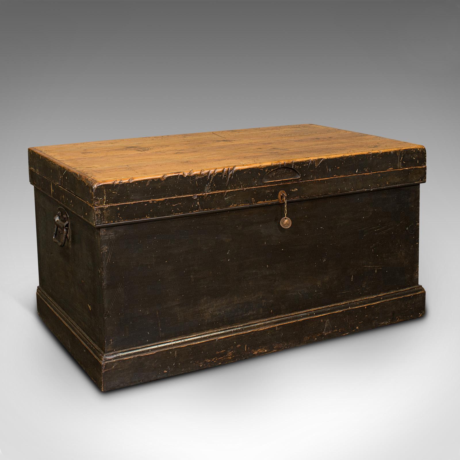 This is an antique shipwright's chest. An English, ebonised pine craftsman's tool trunk, dating to the late Victorian period, circa 1900.

Pleasingly aged maritime chest with useful interior
Displays a desirable aged patina throughout
Ebonised