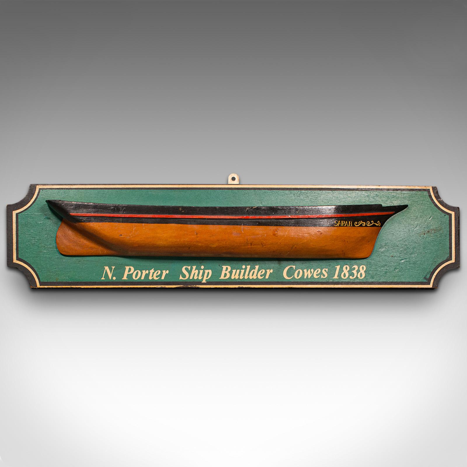 This is an antique shipwright's example board. An English, pine decorative half hull model, dating to the Edwardian period, circa 1910.

Appealing hand-crafted example of maritime decor
Displays a desirable aged patina an in good order
Painted