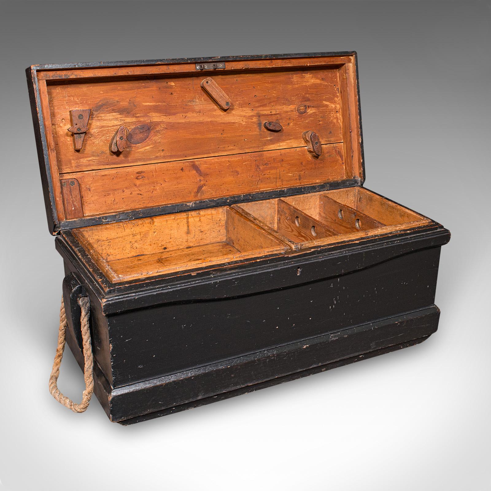 This is an antique shipwright’s tool chest. An English, ebonised pine workman's trunk, dating to the Victorian period, circa 1880. Delightfully authentic and full of maritime character, this robust chest exudes industrial charm and would make a