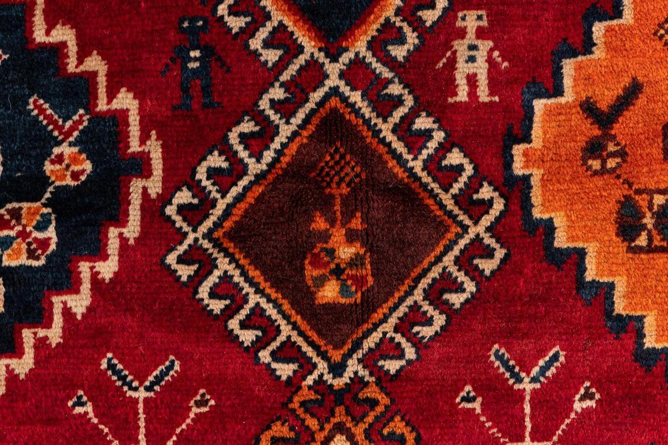 Shiraz – Southern Persia
Splendid antique Persian carpet from the city of Shiraz. This carpet reflects the art of the nomads of southern Persia. The rug features two large central medallions and two smaller ones surrounded by geometric and human