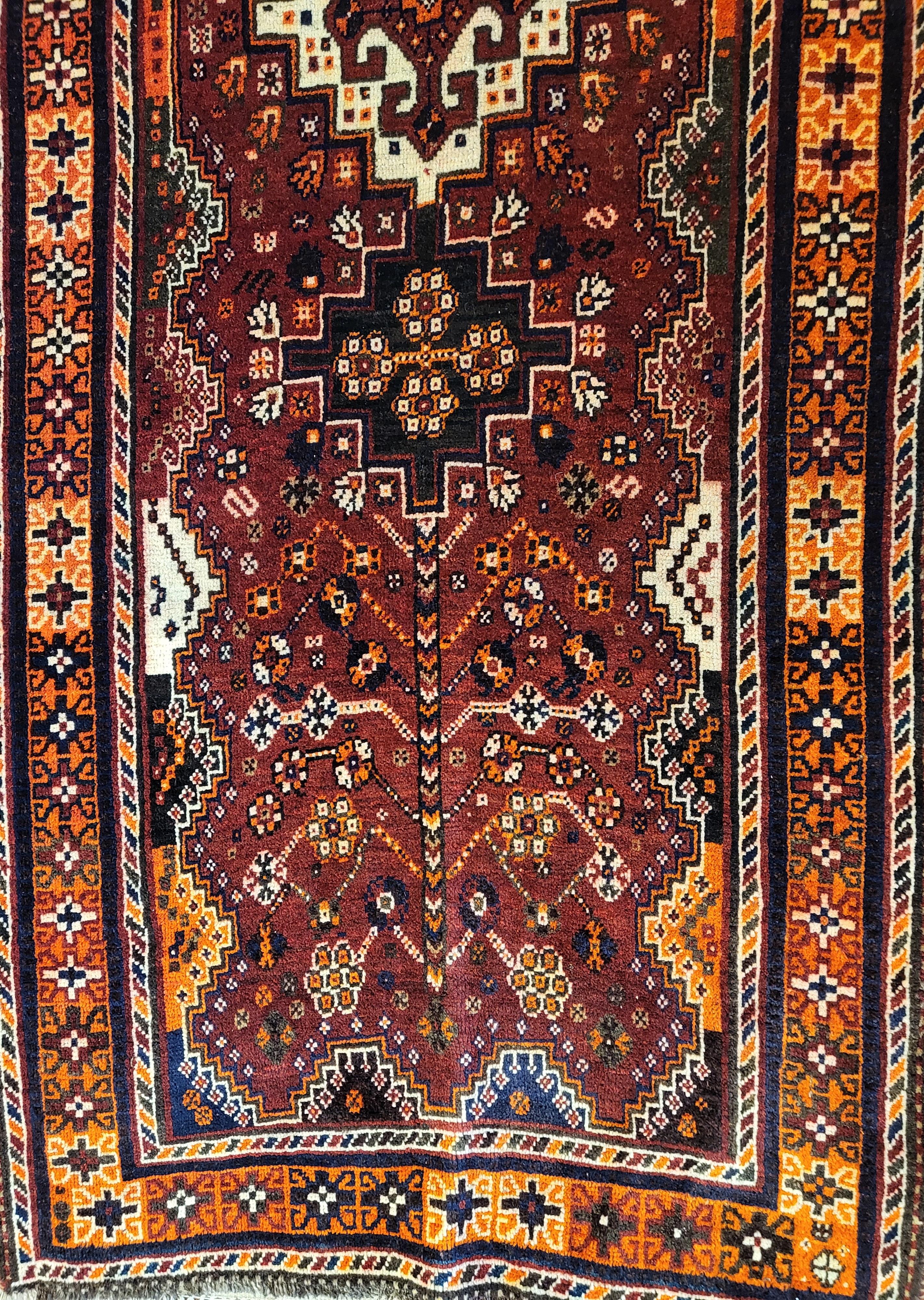 Immaculate Rahimi of the Qashqais
3'3 x 9'3, Rust and Orange Runner

Hand woven entirely of wool raised, sheared, spun, dyed and woven by the nomadic tribal people known as the Rahimis

Known as the kind people. The Rahimis are a very talented