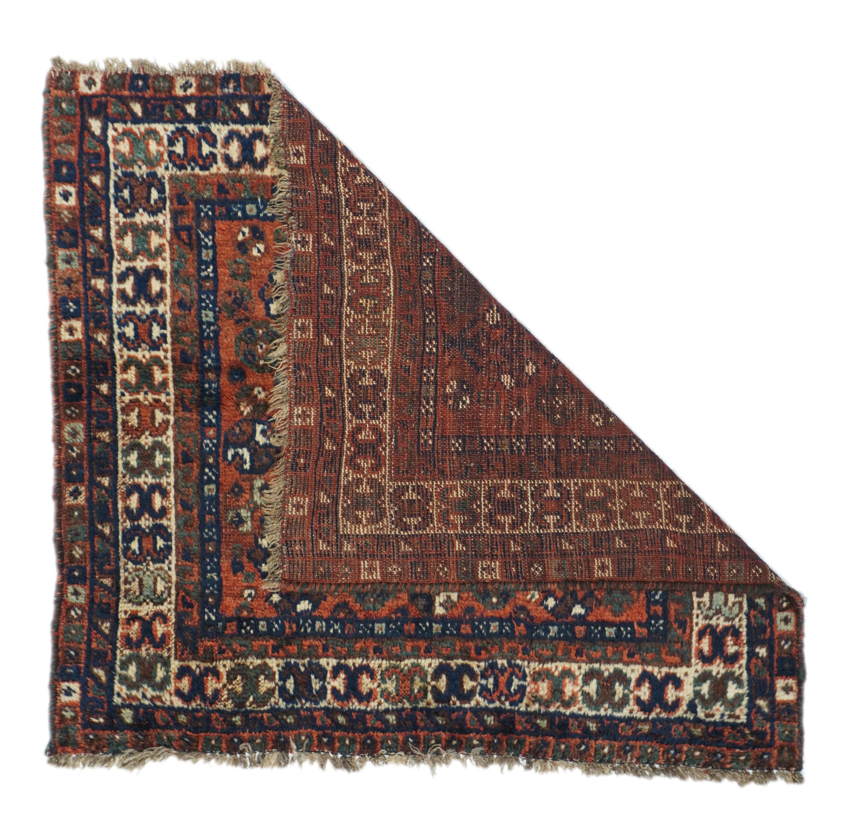 Antique Shiraz Rug 2'9'' x 3'1''. Or a giant bag-face. Red field with stepped octagonal navy medallion centralized by a stylized palmette cross. Navy-accented flowers and rosettes in the field. Ivory border with X curled at tips. Wool foundation,