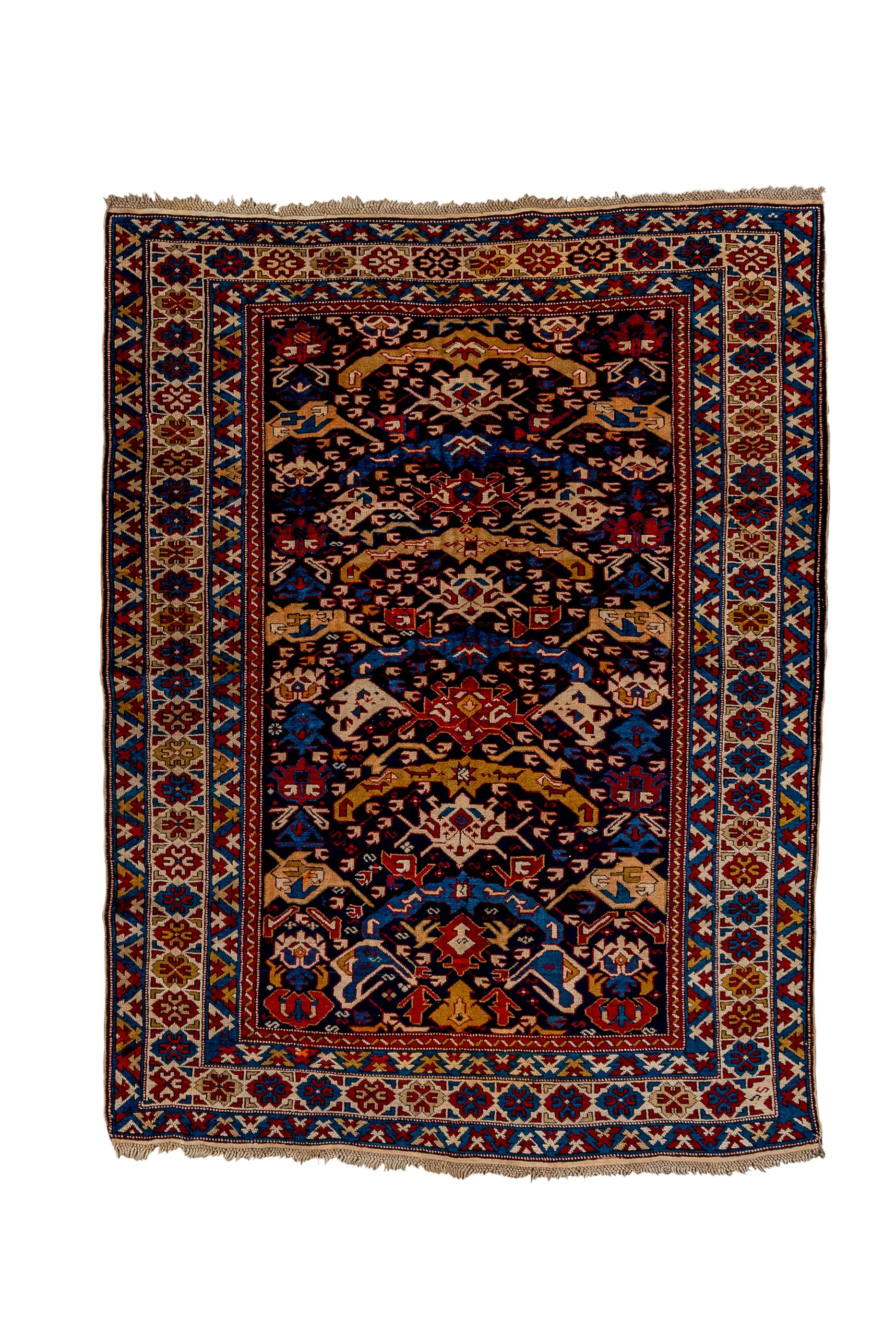 This west Caspian Bidjov village scatter from the Shirvan/Kuba area shows an ascending, one way design of stylized arching elements, abstract palmettes and a multitude of small C’s in shades of red, blue and camel/straw, in relief on the corroded