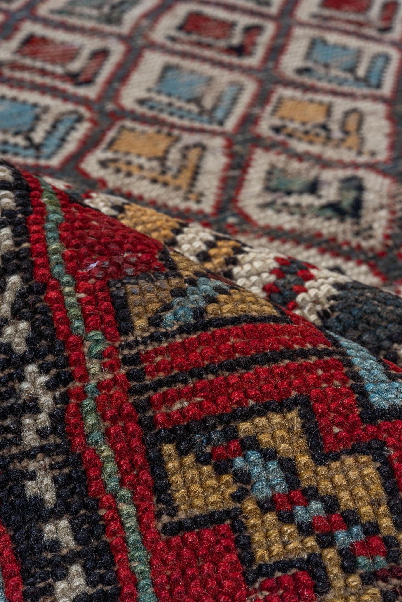 This is an exquisite Shirvan rug measuring 3.5 x 4.9 feet. It showcases a beautifully detailed prayer-style design with geometric patterns in harmonious tones of ivory, red, and earthy hues. The intricate border frames the central field, enhancing