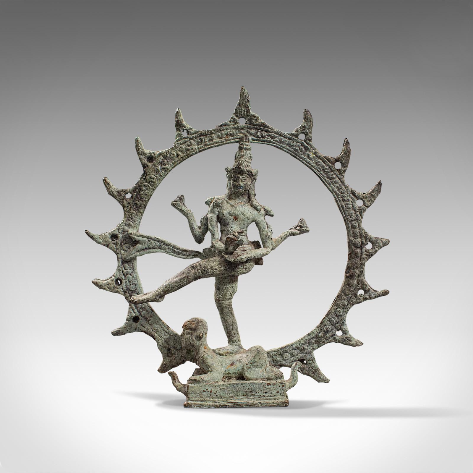 This is a beguiling antique Shiva Nataraja figure. An Indian, bronze mystic statue standing upon Apasmarapurusa or the 'Dwarf of Ignorance', dating to the 17th century.

Centuries old and beautifully aged, this figure depicts Shiva as the lord of
