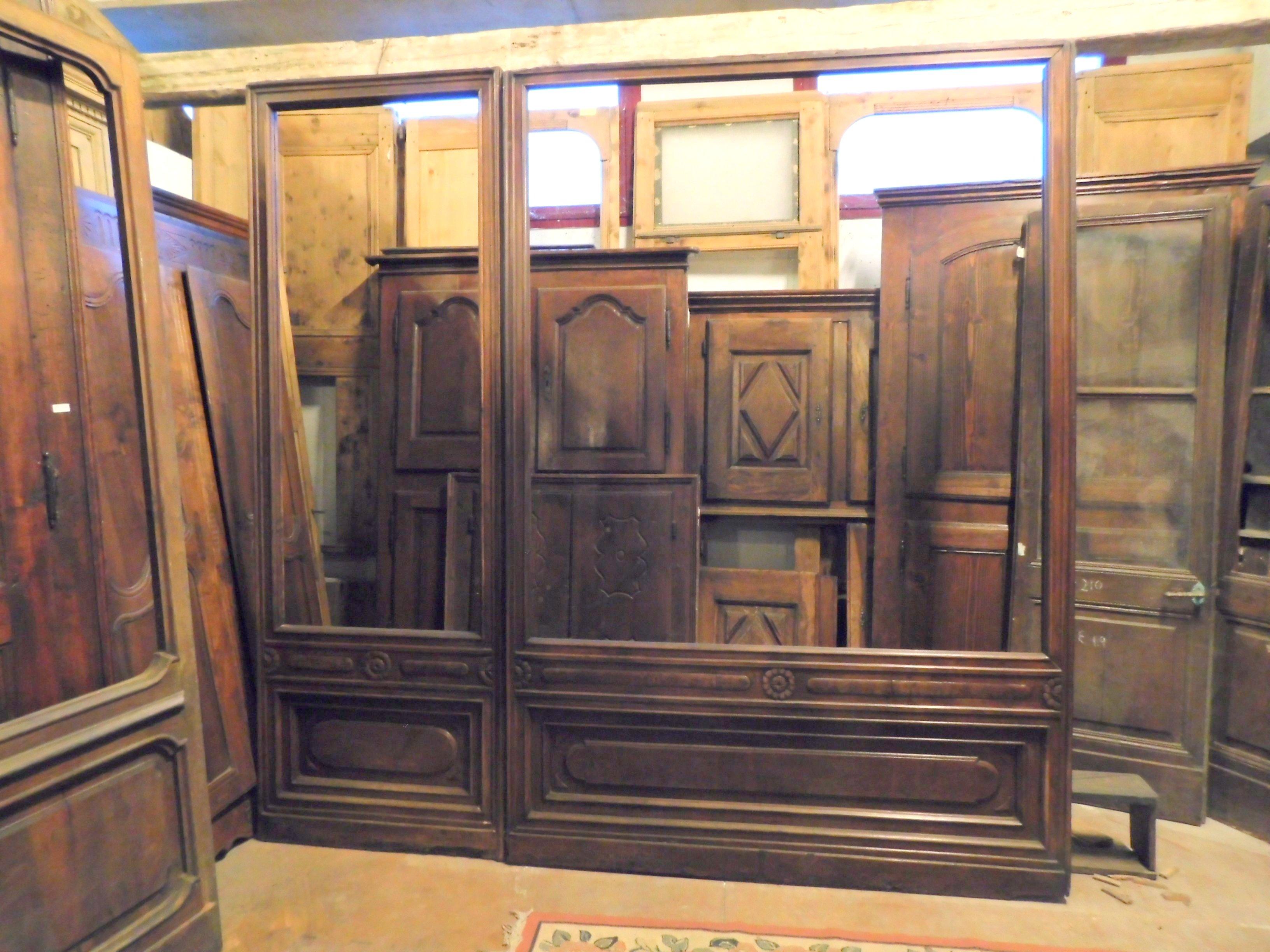 Antique shop facade in walnut, carved by hand, composed of two parts: a door and a fixed part of the shop window, all original from the early 19th century, built by local craftsman by hand, for a shop in the center of Turin (Italy).
Measure cm W