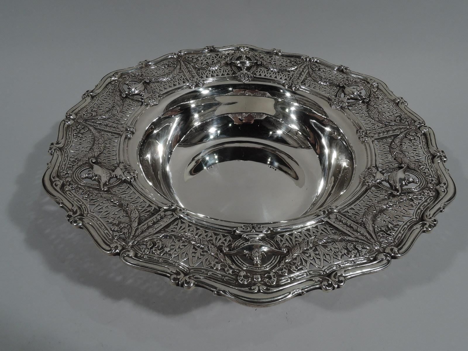 Edwardian Regency sterling silver centerpiece bowl in Adam pattern. Made by Shreve & Co. in San Francisco, circa 1915. Solid and tapering well. Wide shoulder with Classical vases on open rondels joined by leaf swag on pierced fern ground. Scrolled