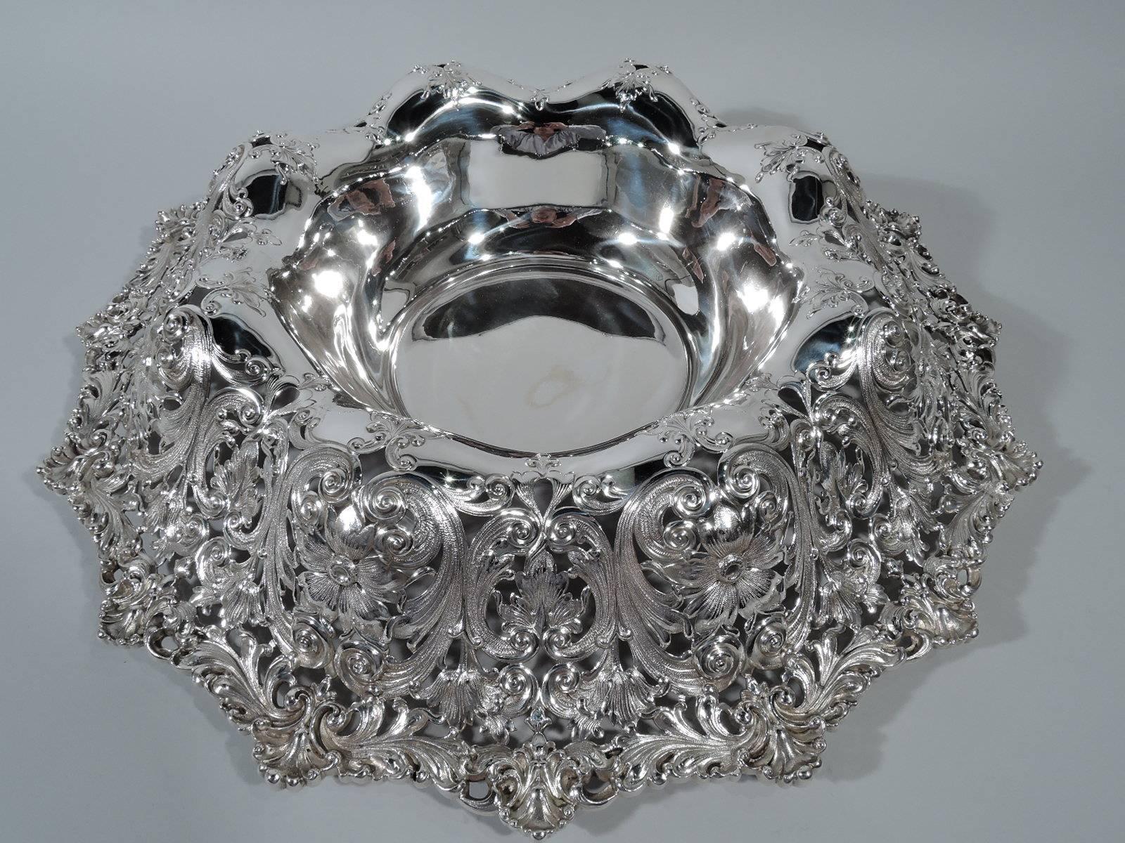 Sumptuous sterling silver centrepiece bowl. Made by Shreve & Co. in San Francisco, circa 1900. Plain well and turned-down and lobed sides with pierced flowers, foliage, shells, and scrolls. Gilded Age magnificence. Hallmarked. Weight: 87 troy ounces.