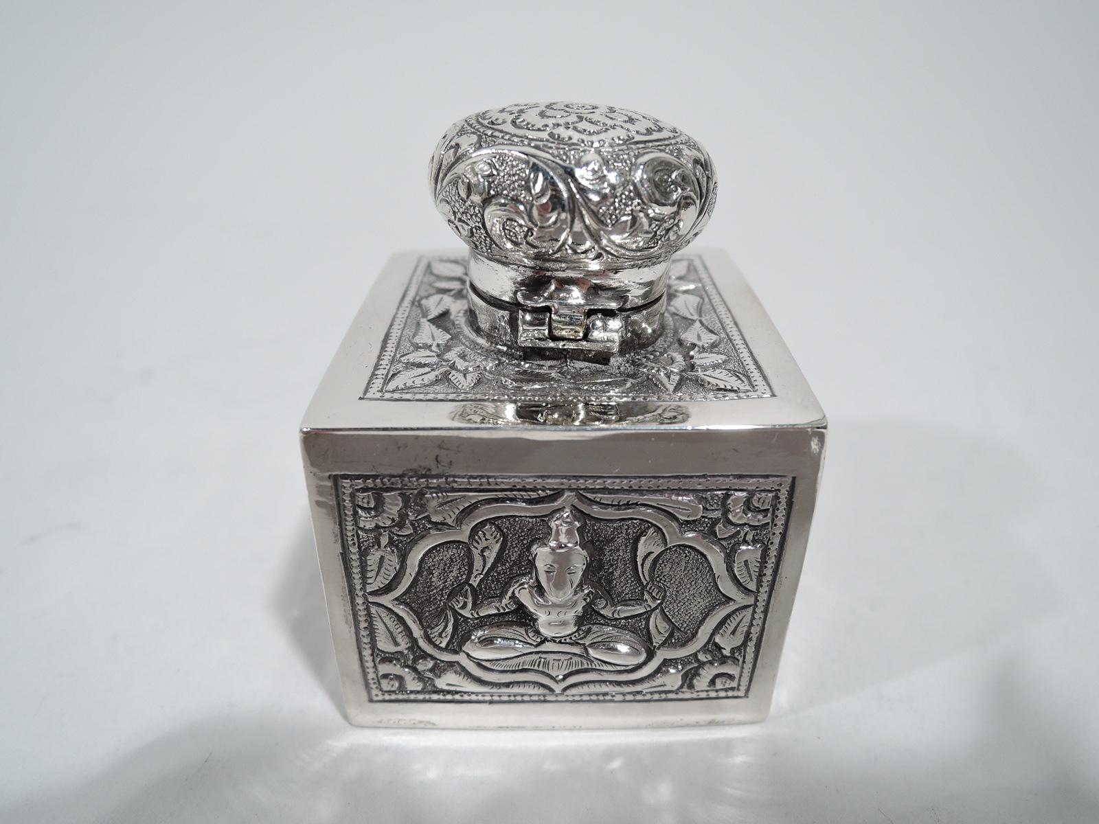 Siamese silver inkwell, circa 1920. Cubic with cross-legged yogi and dancing contortionists in mandala frames. Cover hinged with tooled and repousse scrolls and flowers. Unmarked. Weight: 2.4 troy ounces.