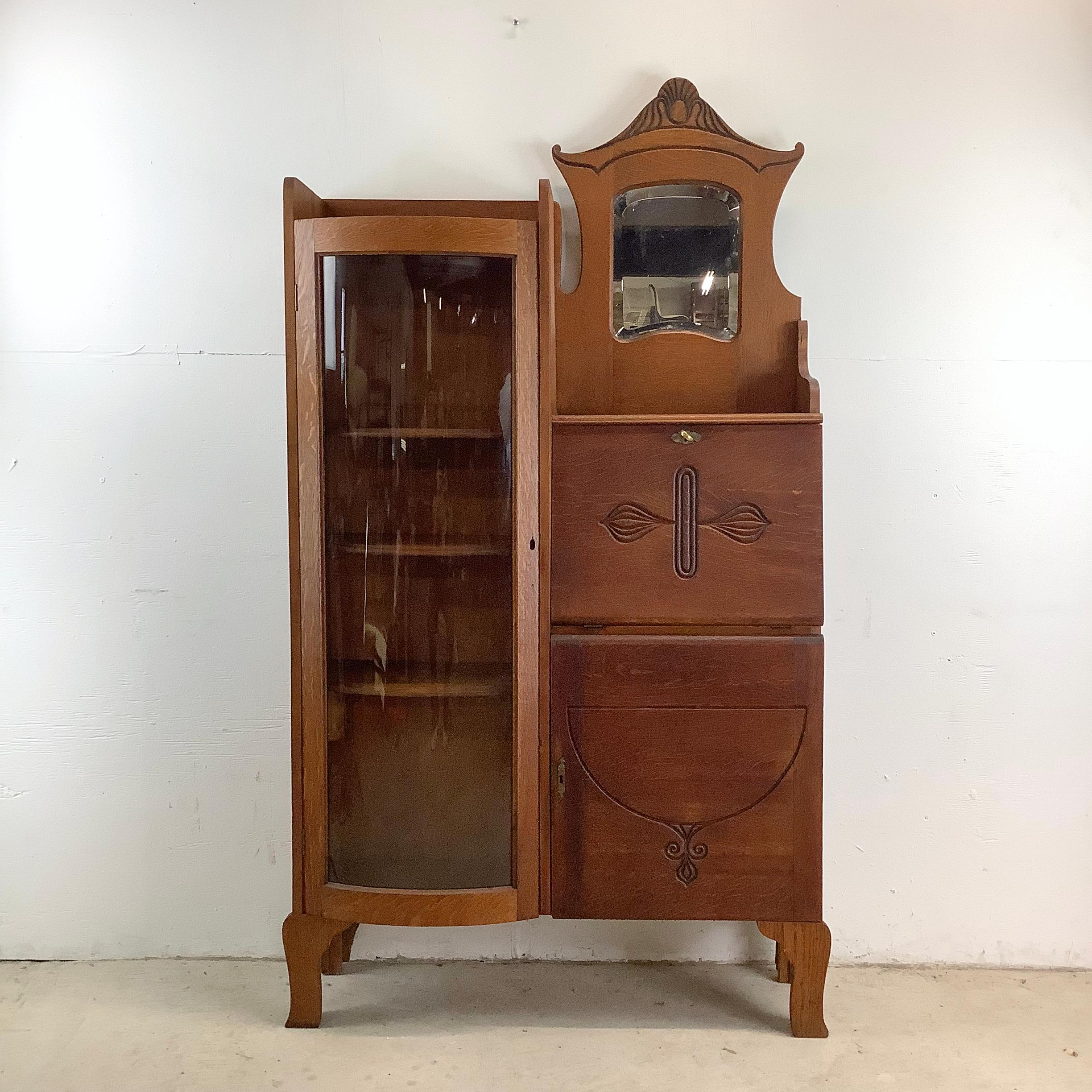 This Antique Side by Side Cabinet with Locking Display Shelves and Drop Front Desk is a beautiful example of timeless design meeting practical functionality. The display shelves, secured by a locking mechanism, allow you to safely exhibit your most