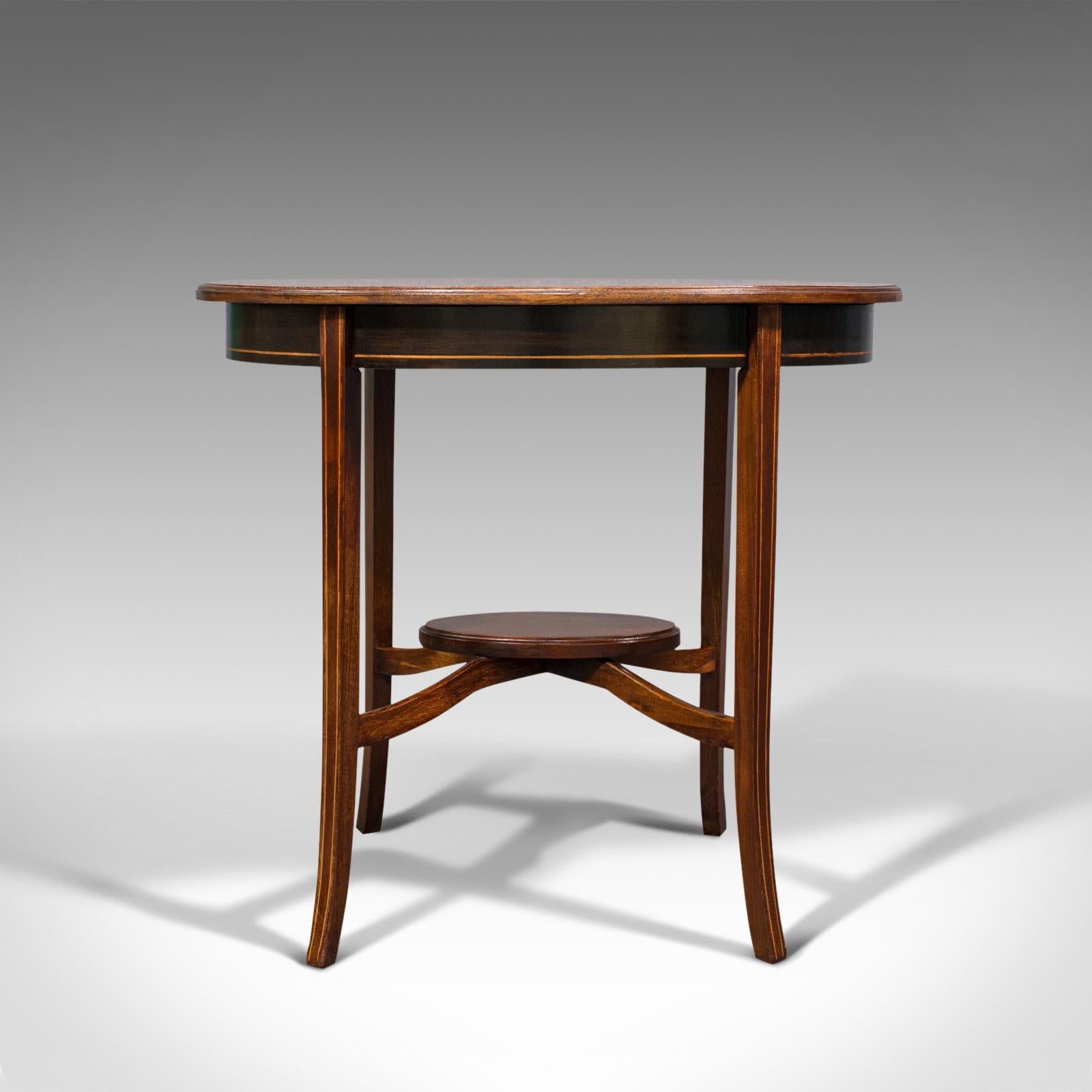 This is an antique side table. An English, mahogany and walnut lamp or occasional table, dating to the Regency period, circa 1820.

Delightfully finished, attractive Regency craftsmanship
Displaying a desirable aged patina and in good