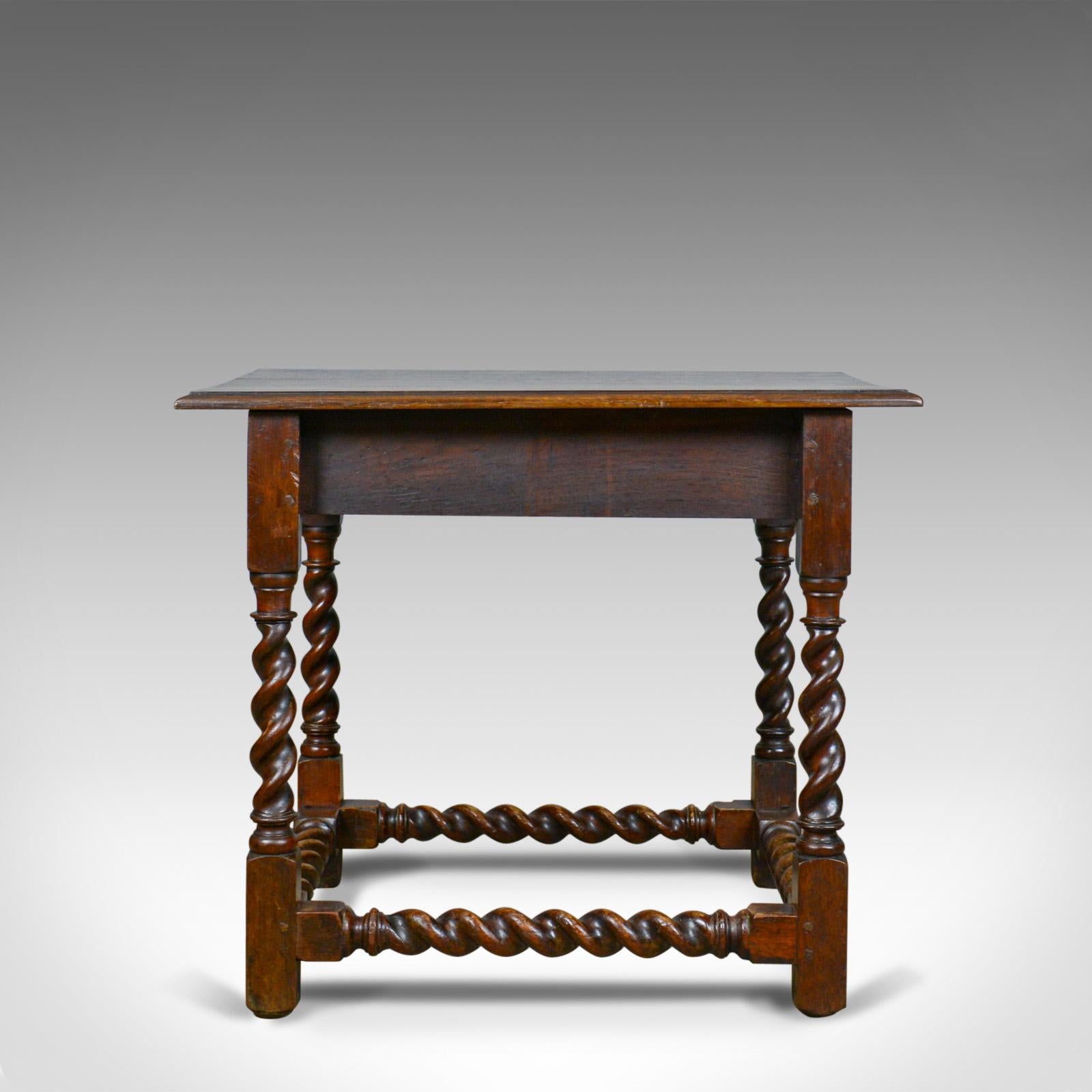 This is an antique side table. A Victorian, English, oak table dating to the late 19th century, circa 1880.

Broad top displays well featuring edge moulding
Good consistent color with a wax polished finish
Displaying a desirable aged