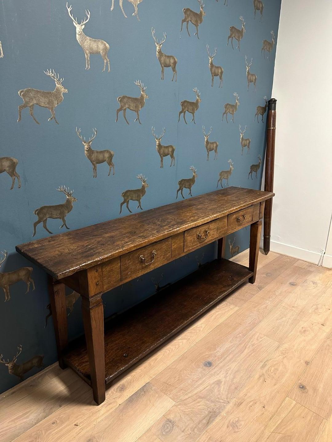 Beautiful weathered teak console table. With 3 drawers and bottom shelf. Completely in perfect condition.
Origin: Dutch East Indies
Period: Approx. 1900
Size: 188cm x 38cm x h.76cm