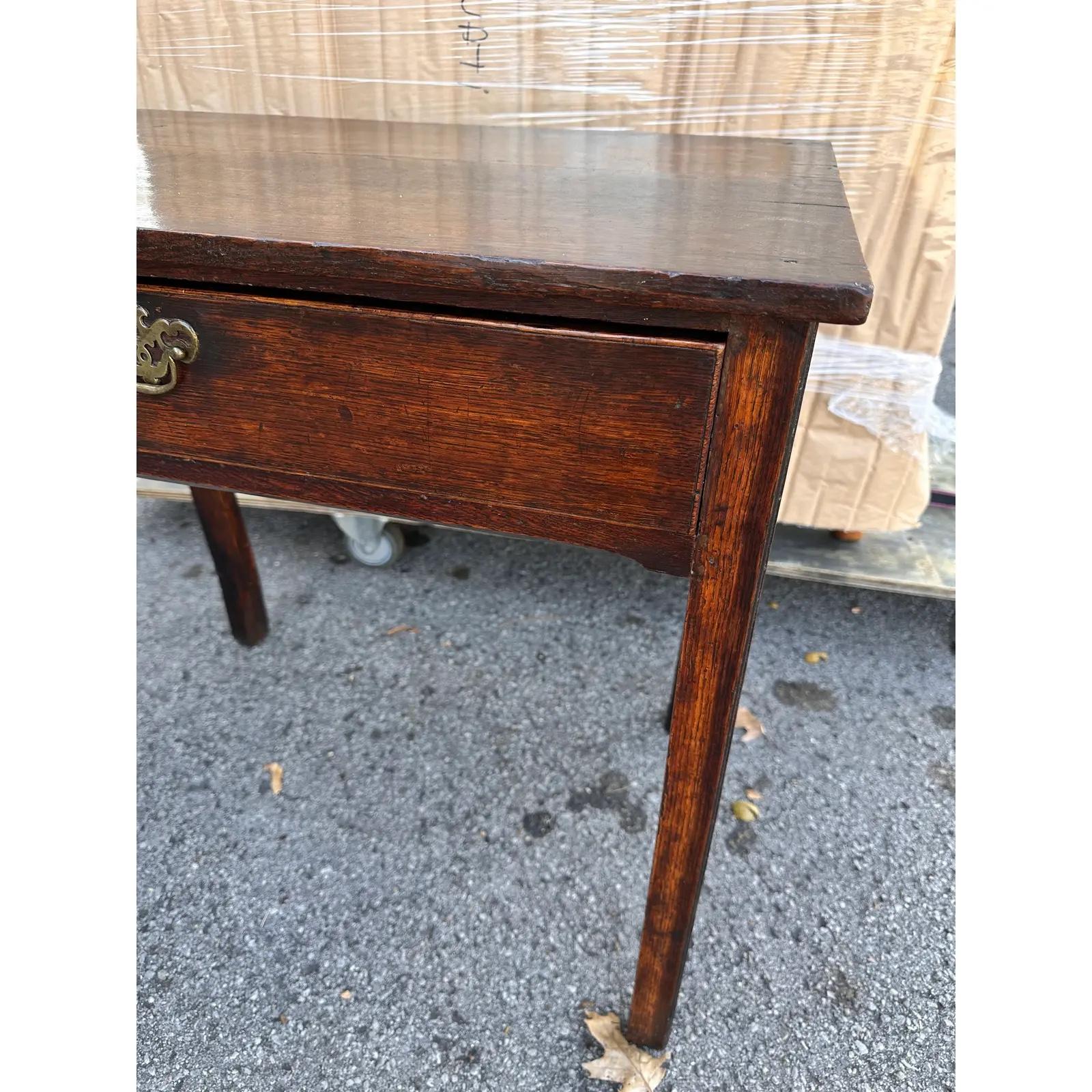This is a beautiful English side table! The color and patina of this piece is amazing! This side table is sturdy and mature and features a single sliding drawer for function. This piece is excellent way to add history and character to any home. #653