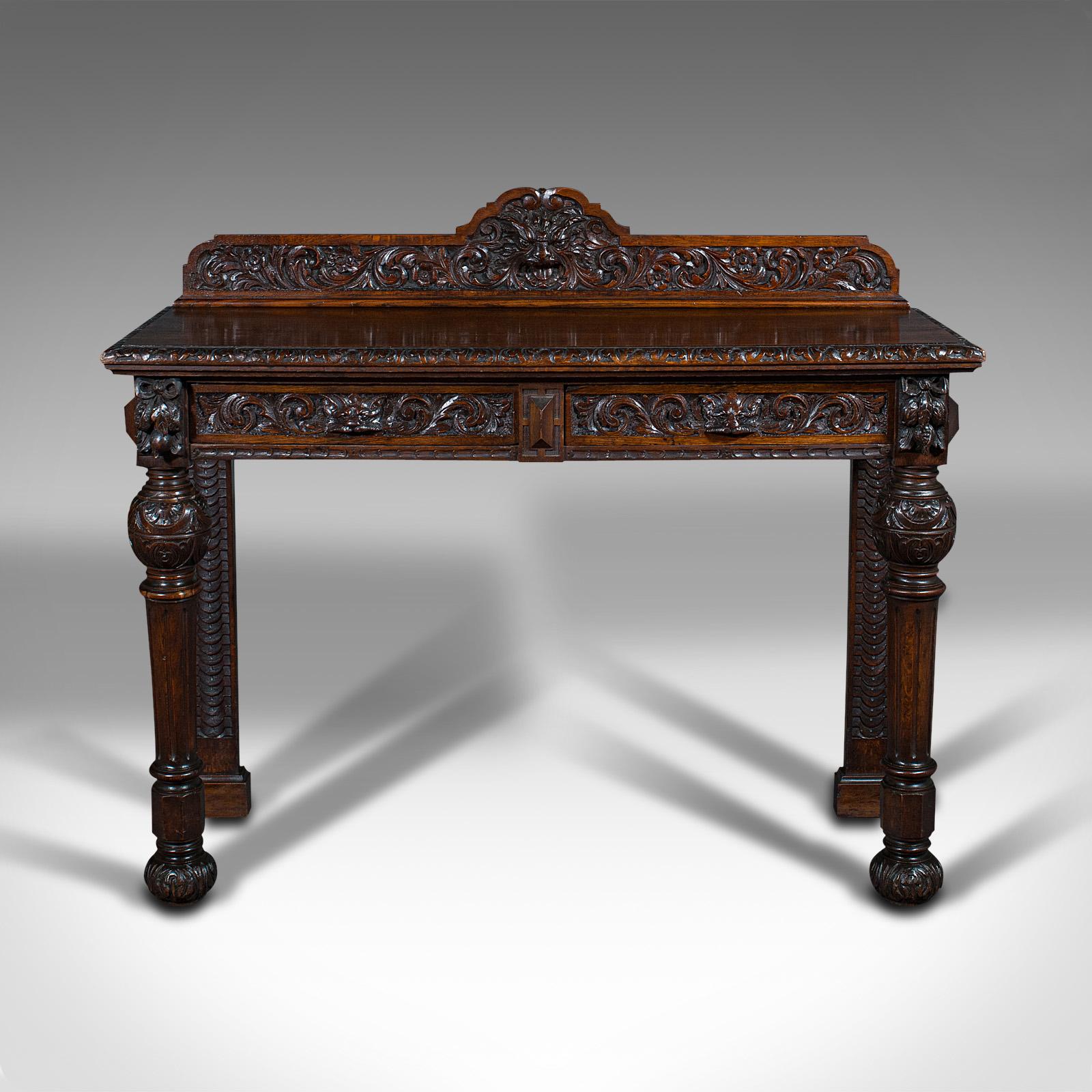 This is an antique side table. A Scottish, oak console table with heavily carved Gothic revival taste, dating to the Victorian period, circa 1880.

Superb example of Scottish Gothic revival taste with enthusiastic carved decoration
Displays a