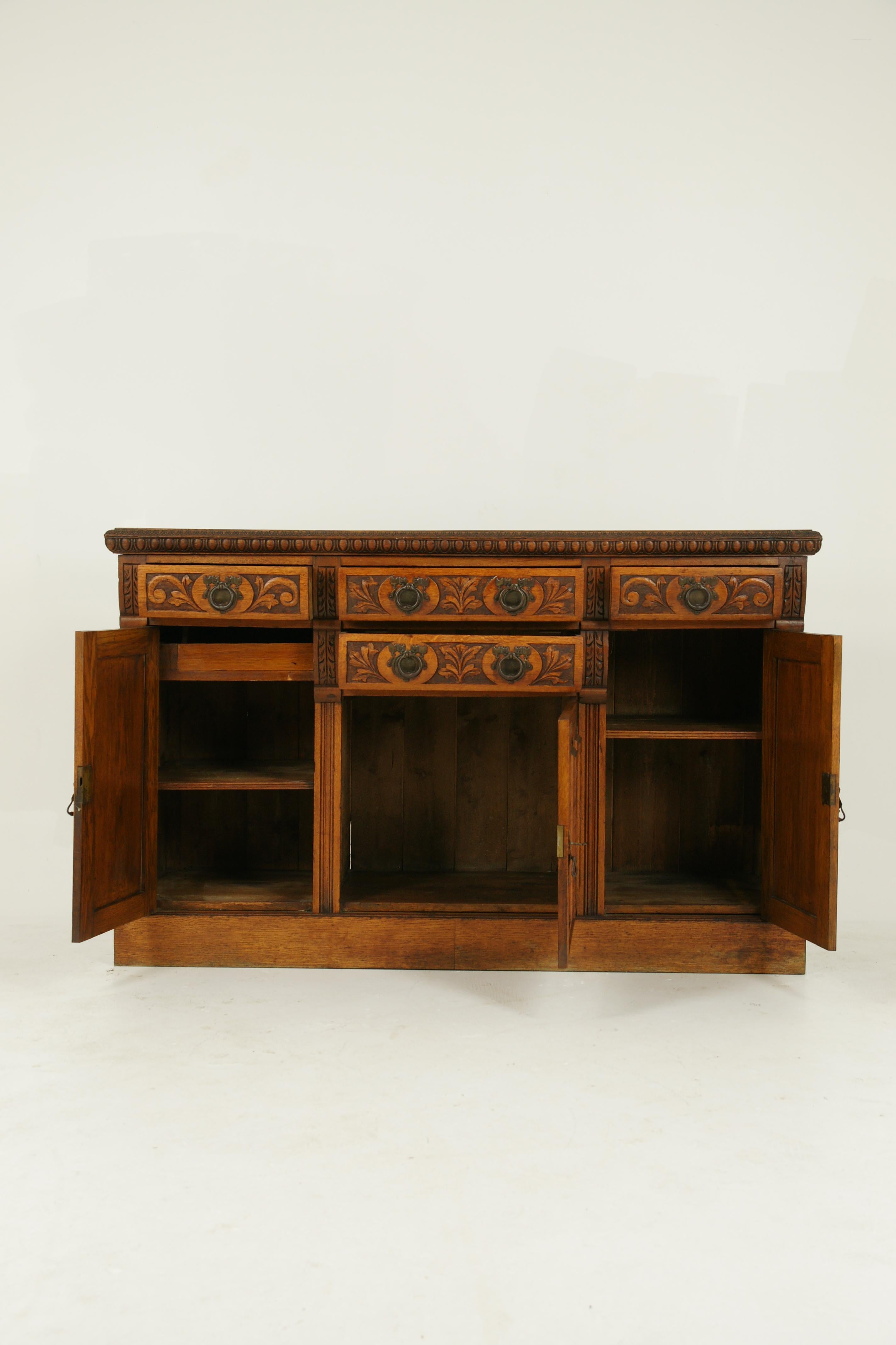 Antique sideboard, carved oak, oak buffet, Scotland, 1910, Antique Furniture, B1579

Scotland, 1910
Solid oak construction
Original finish
Rectangular top
Carved frieze below
Pair of carved drawers with original hardware
Below a carved