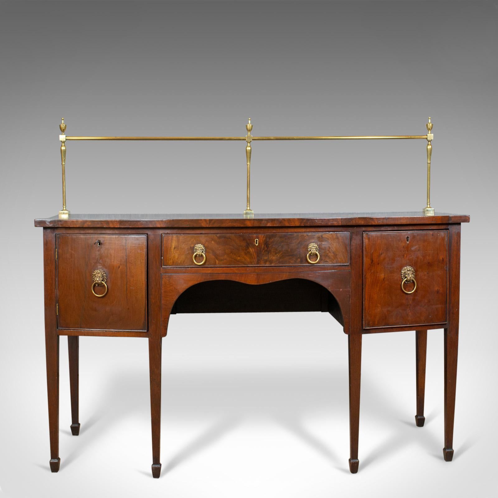 This is an antique sideboard. An English, Regency server in mahogany dating to the early 19th century circa 1830.

Select mahogany with grain interest throughout
Desirable aged patina in the lustrous, wax polished finish
Displaying Sheraton