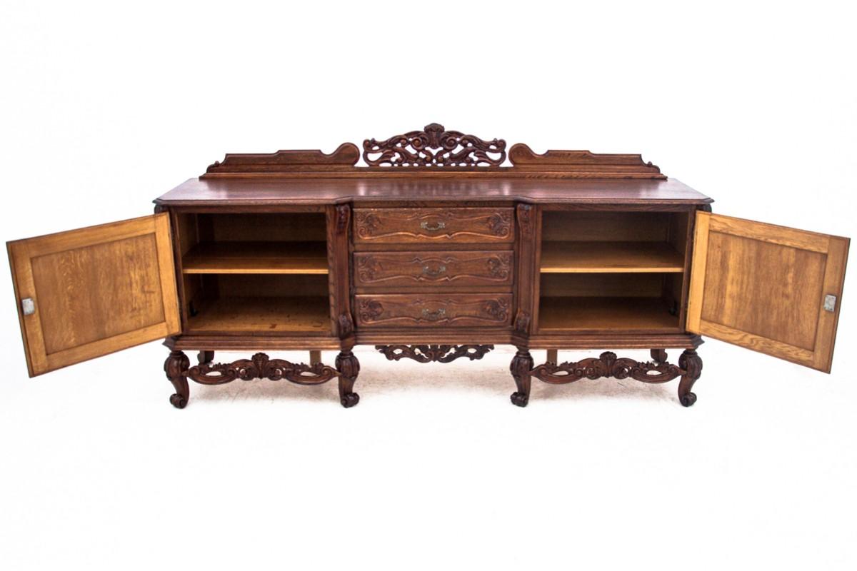 A stylish, Louis-style chest of drawers from the late 19th century.

Antique furniture with a more beautiful form will add elegance to any interior.

A large chest of drawers beautifully decorated with woodcarving rests on heavily carved ones