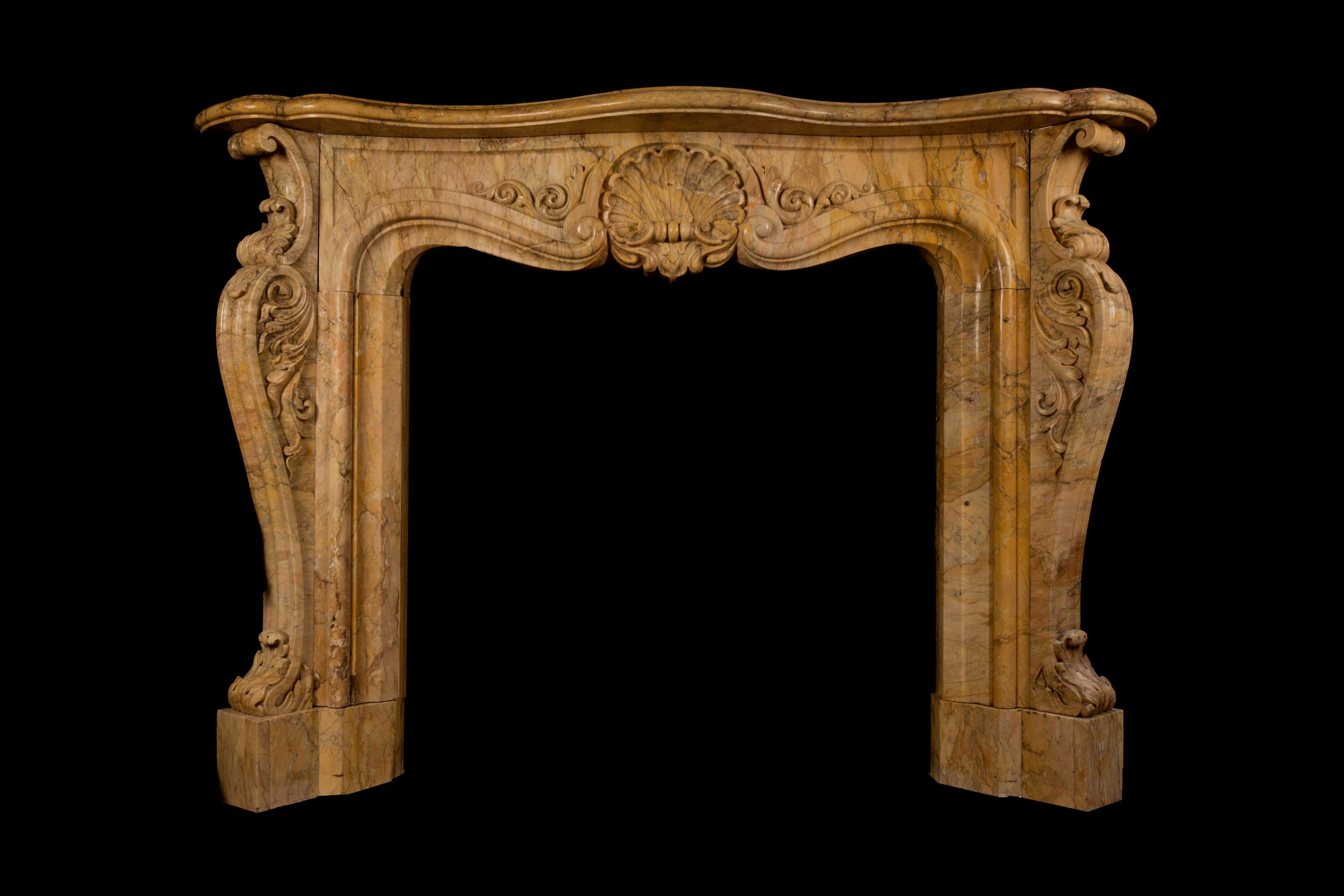Carved Antique Sienna Marble Fireplace in the Rococo Revival Style For Sale