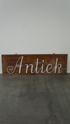 Antique sign/advertising board hand-painted on hardboard