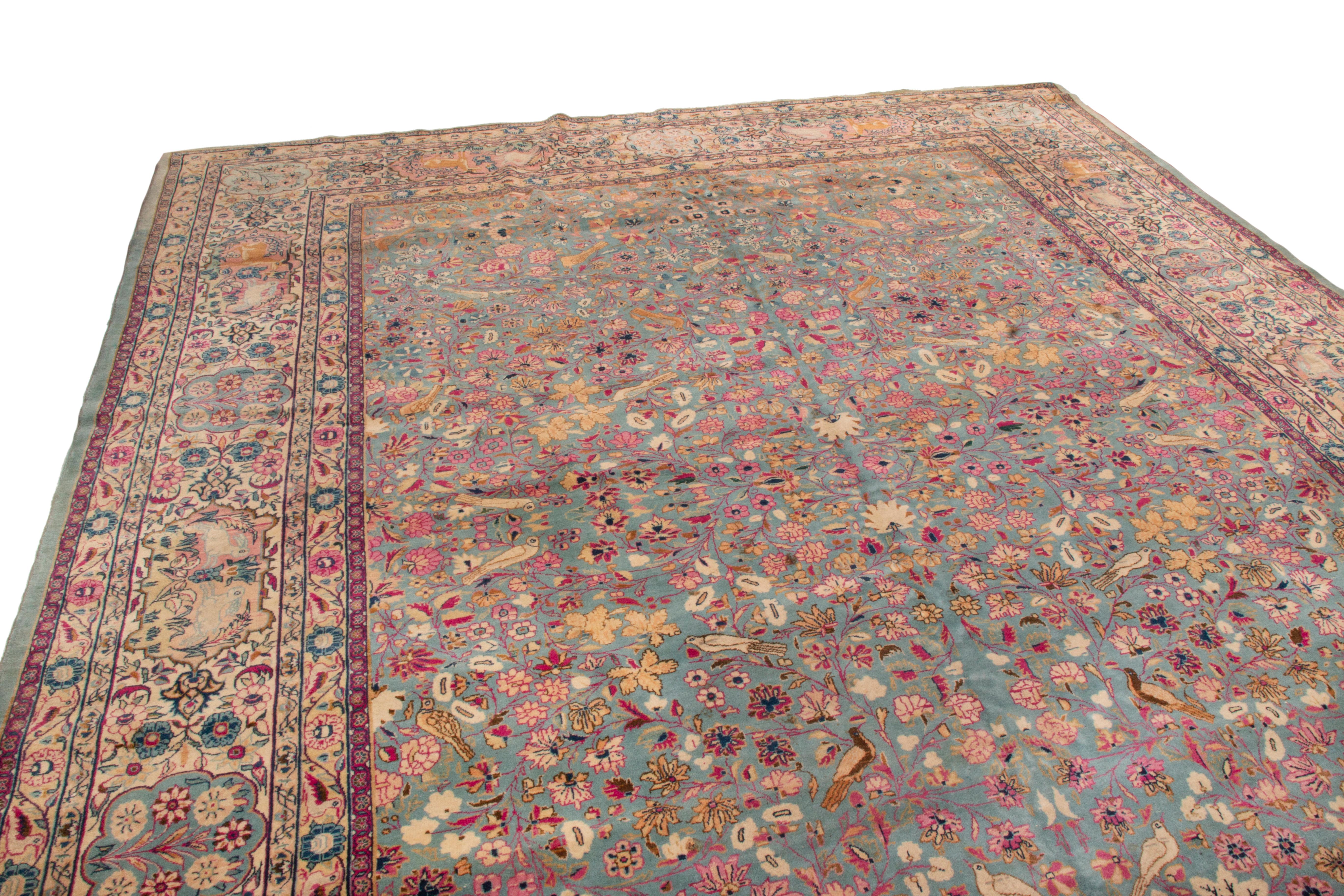 This antique Kashan wool rug is a signature piece from the Dabir family, one of the most widely regarded Kashan signature families. From 1910, the traditional all-over floral design is moderately uncommon, whereas many Kashan pieces of the era