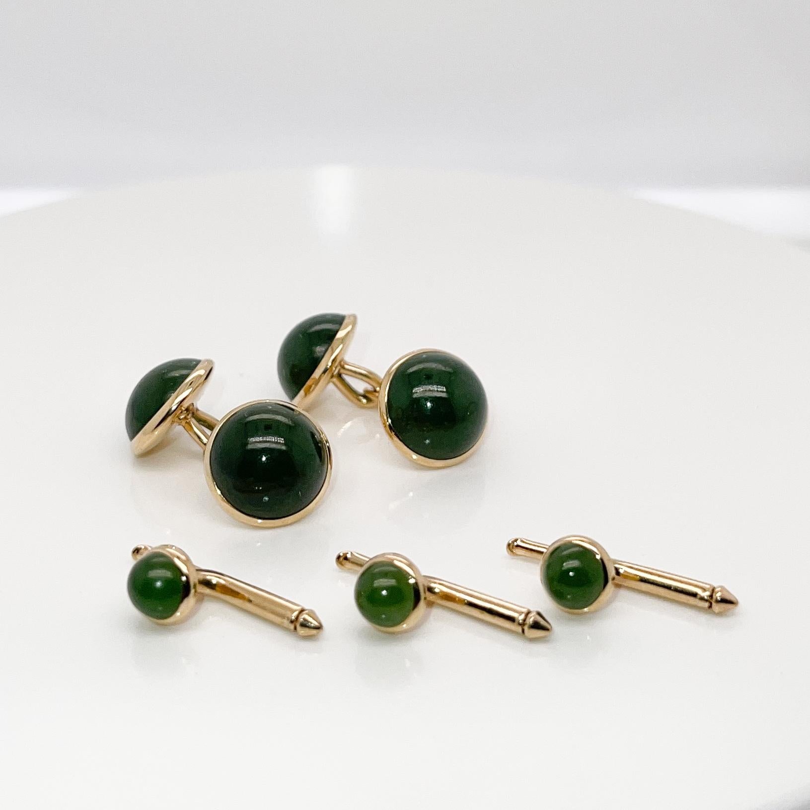 A very fine signed, antique American dress set.

Comprised of a pair of Carrington & Co. cufflinks together with 3 associated Larter & Sons buttons.

With smooth round nephrite cabochons bezel set in 14k gold. 

Simply a wonderful, high-level set