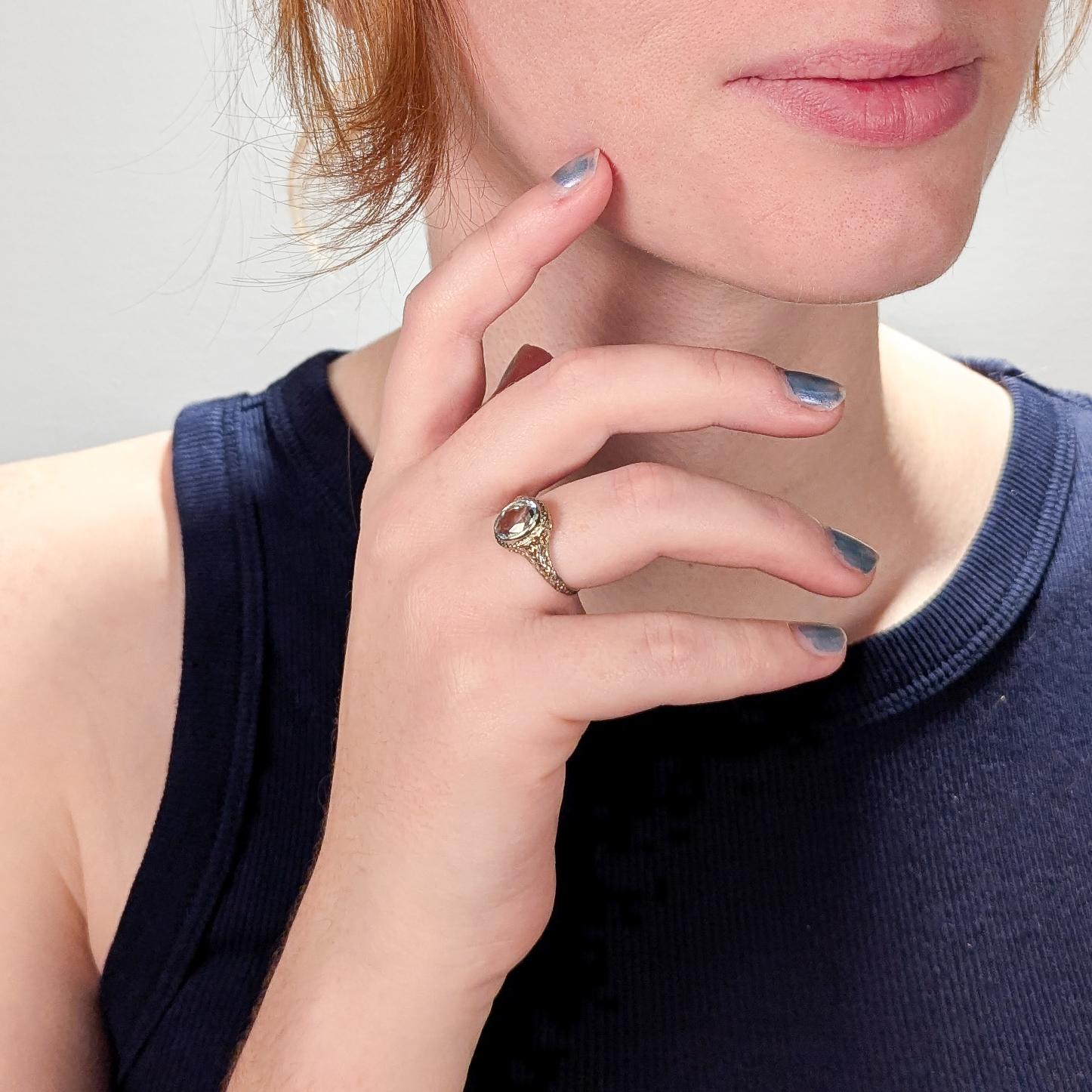 A fine, signed antique aquamarine signet style ring.

By Dattlebaum & Friedman of NYC.

In 14 karat white gold.

Bezel-set with a ca. 1.4 ct oval modified brilliant cut aquamarine.

Marked to the shank with D&F maker's mark / 14K.

Accompanied by a