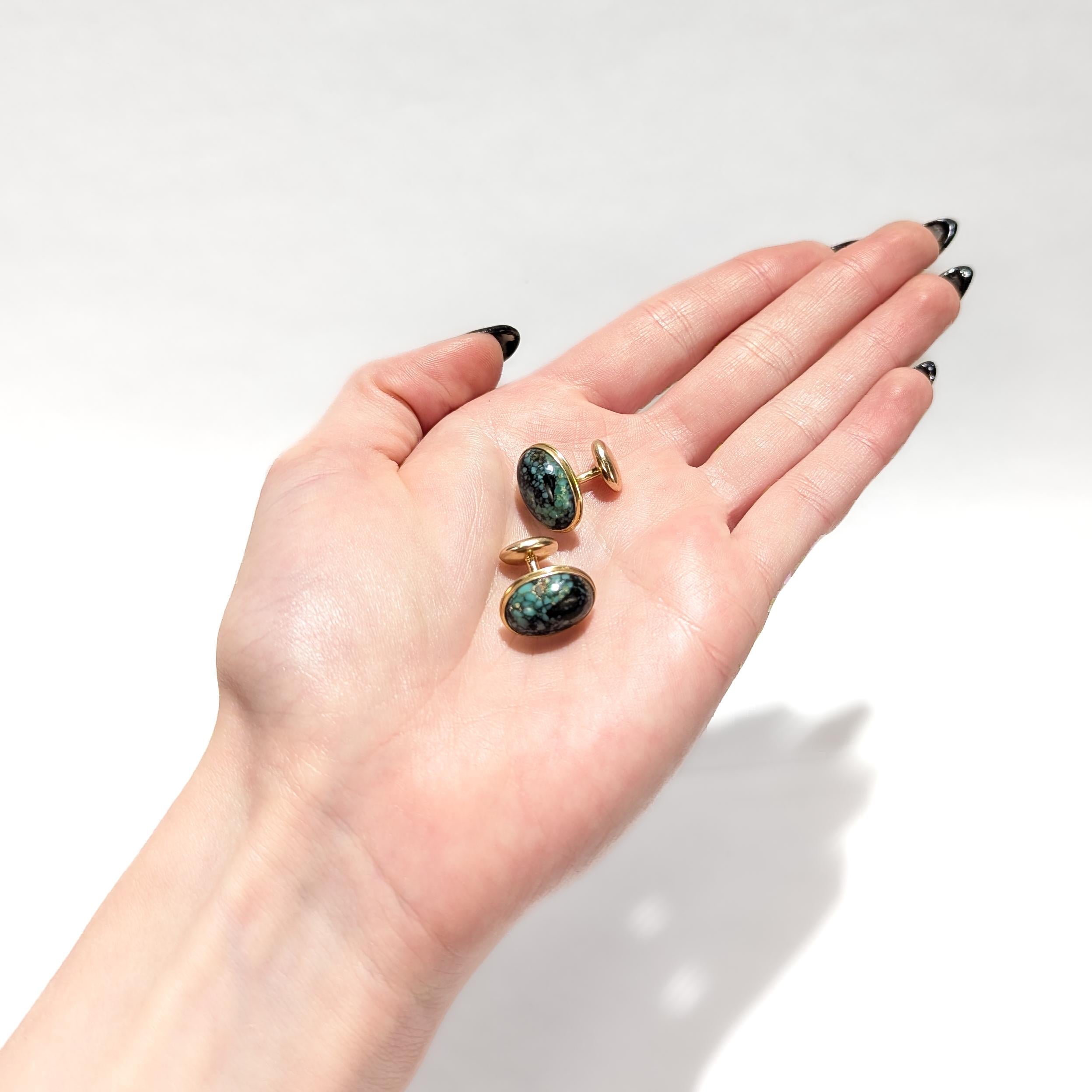 A fine pair of signed antique cufflinks.

In 10 karat yellow gold.

By AJM Co. 

Each with an oval shaped turquoise cabochon. 

Marked to the post.

Simply a wonderful pair of cufflinks!

Date:
20th Century

Overall Condition:
They are in overall