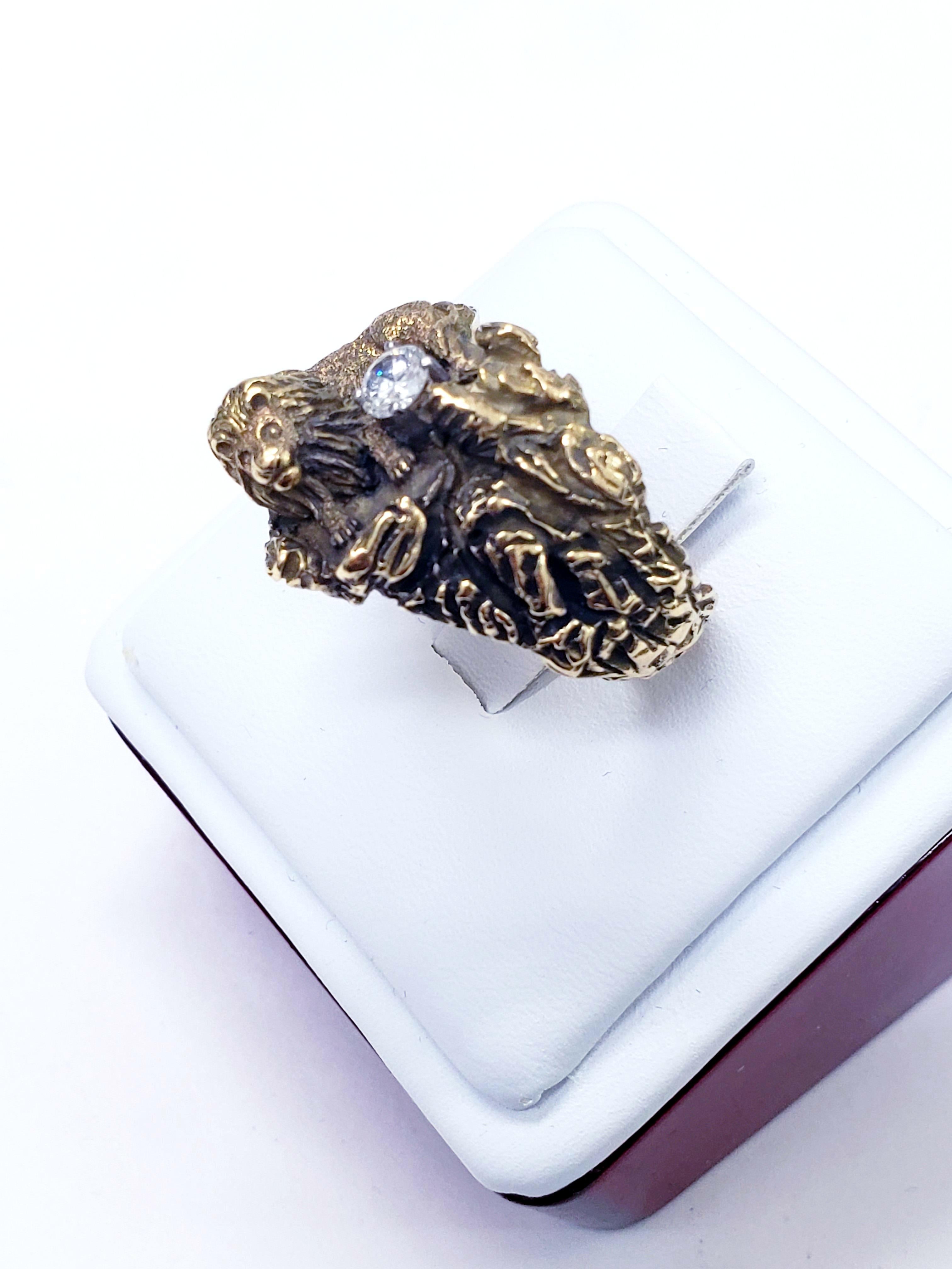 Antique one-of-a-kind Lion guarding diamond ring hand crafted in 14k yellow & black gold to show accents details. 
This is a true piece of art.
Diamond is very clean 0.30 Size 11
Made by famous designer D.W.
This ring will stand out!
The lion is