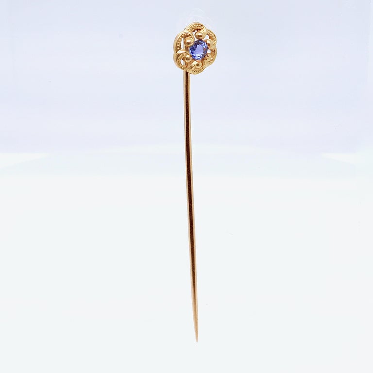 A fine Edwardian stick pin.

By Marcus & Co.

In 14 karat yellow gold with a small, round faceted blue sapphire.

Simply a wonderful signed antique stick pin!

Date:
Early 20th Century

Overall Condition:
It is in overall good, as-pictured, used