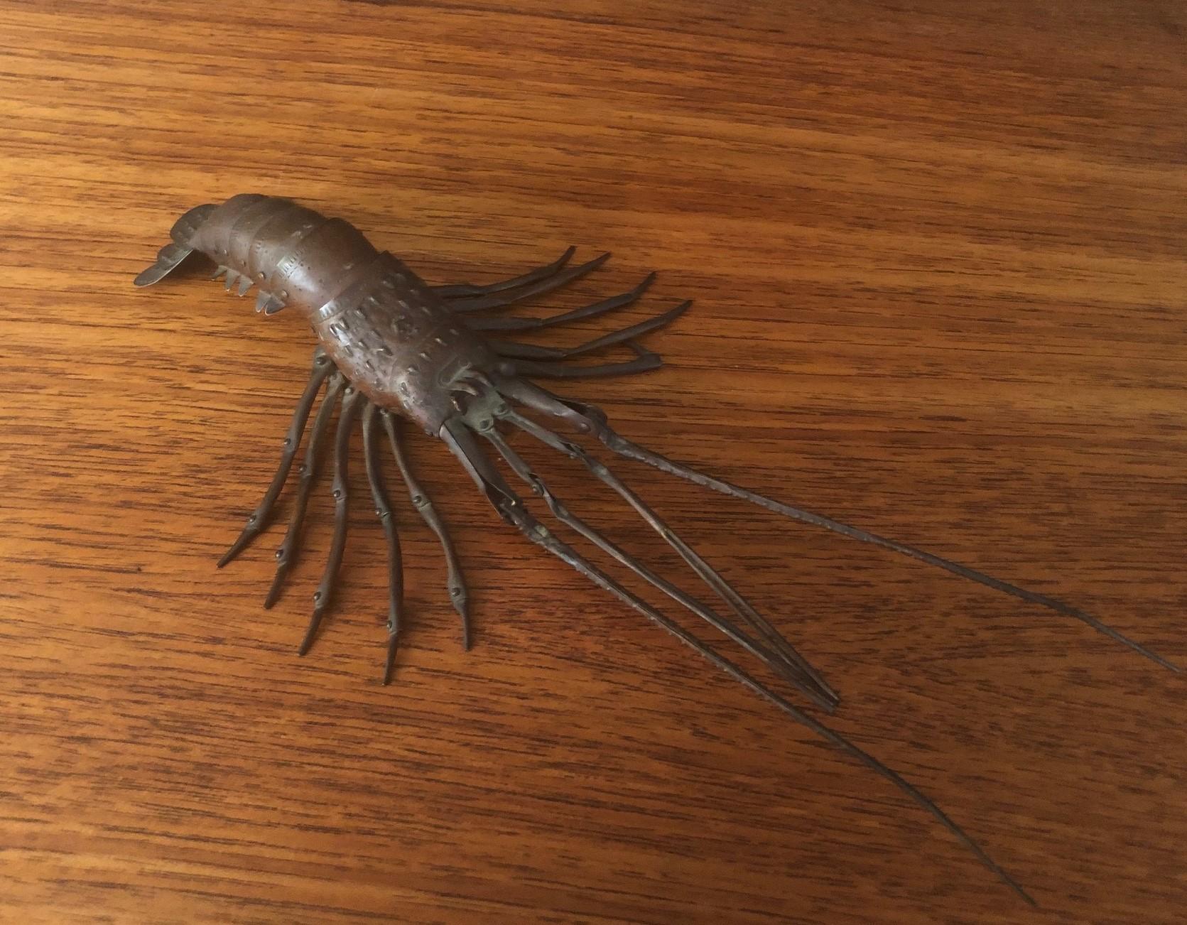Antique signed Japanese articulated lobster / cray fish sculpture (Jizai Okimono) in copper, circa 1910s. The piece is well detailed and patinated.
