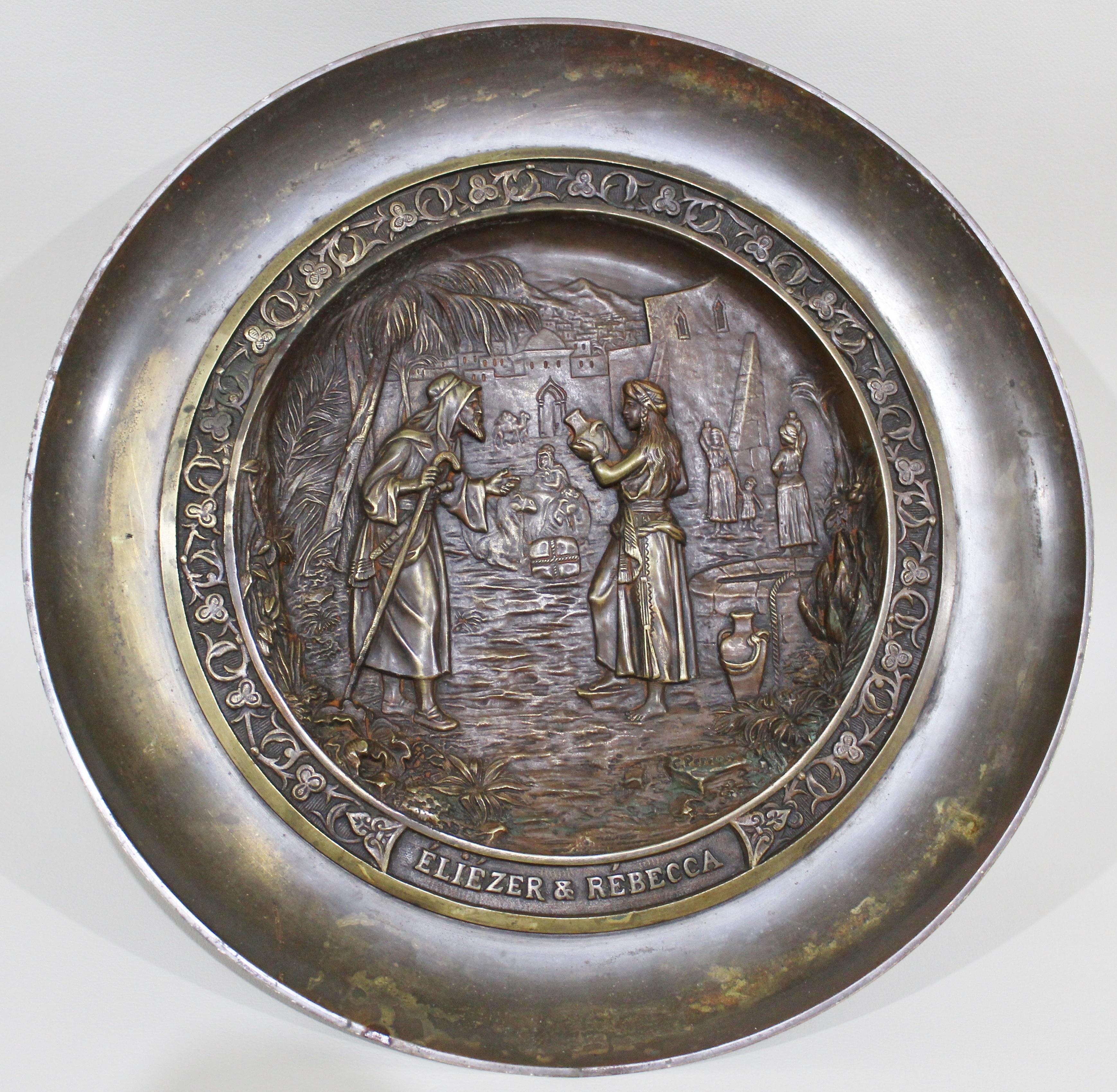 Signed C. Perron cast bronze tazza depicting the Judaic allegorical story of Eliezer finding a wife for Abraham's son Isaac and with the assistance of Rebecca, determines she is the best choice for him. The tazza is clearly signed 