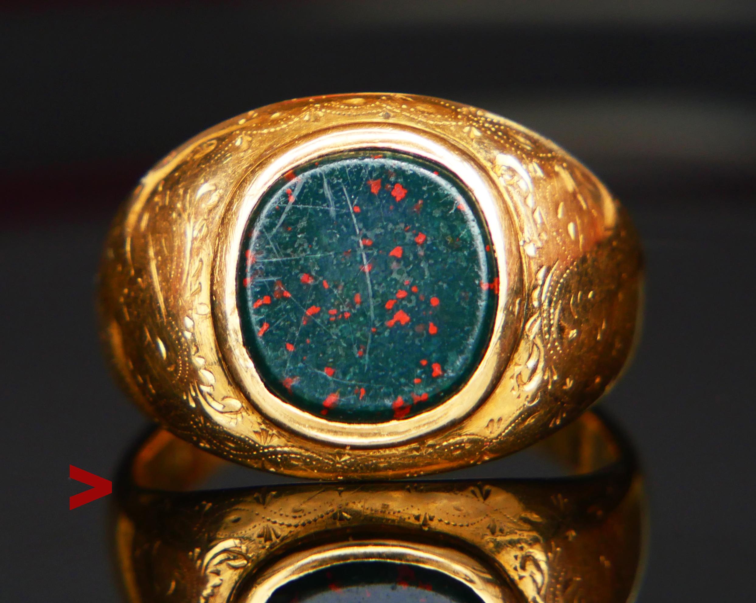 ϟignet Ring for Men decorated with bezel set polished plate of Blood  stone 12 mm x 11.25 mm  / ca. 6 ct. Band is 16.8mm at widest, partially hollow inside with fine hand - engraved shoulders.

Swedish worn hallmarks : 18K and maker's, date