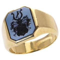 Antique signet ring with a family crest with carved sardonyx intaglio