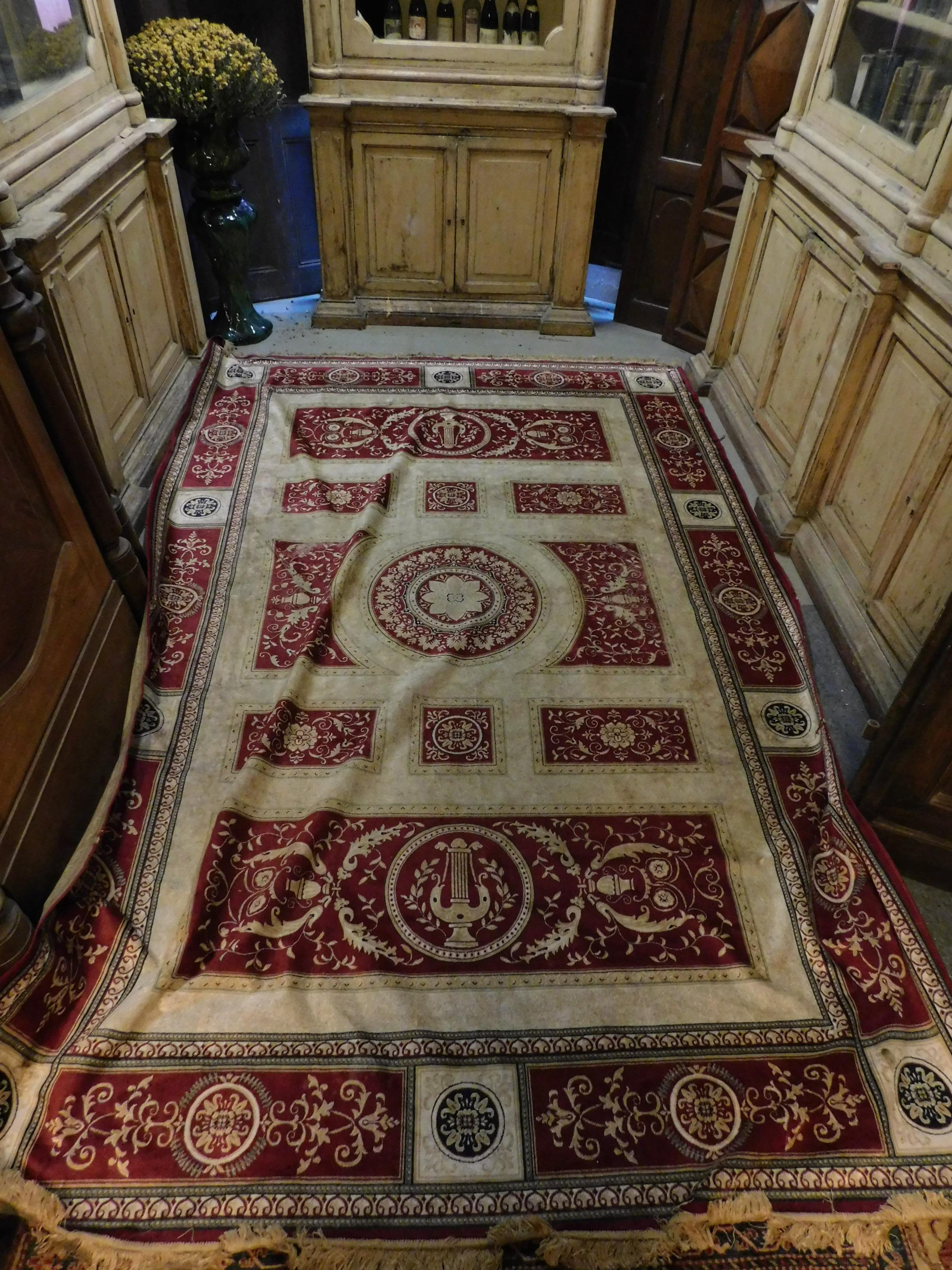 Antique silk carpet hand knotted, has neoclassical motifs such as cups and floral decorations, very large and beautiful, recently washed the colors are bright and elegant.
It comes from the hall of a European castle, very refined and rare in these