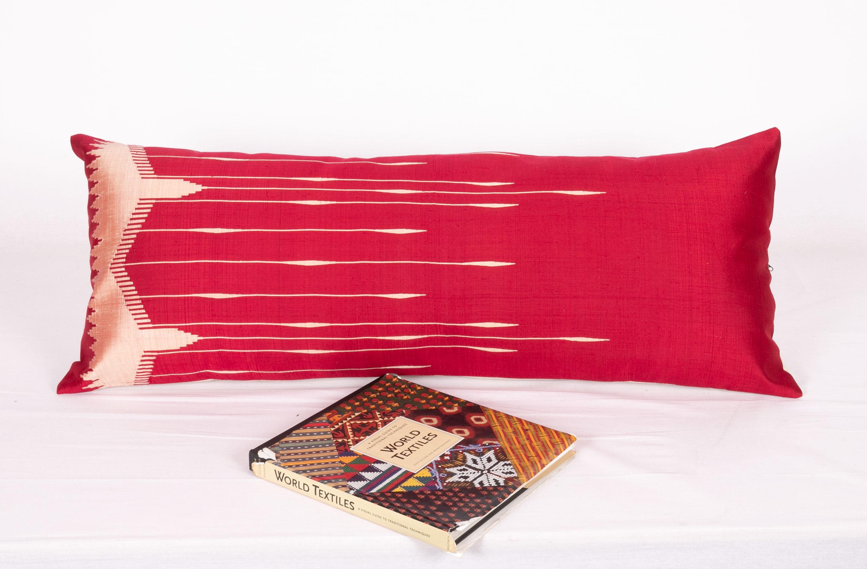 This pillow is made from an antique silk weaving from Turkey.
It does not come with an insert pad but comes with a bag made to the size to accommodate insert materials.
Cotton in the back.
Zipper closure.
Dry clean is reccommended.
    
