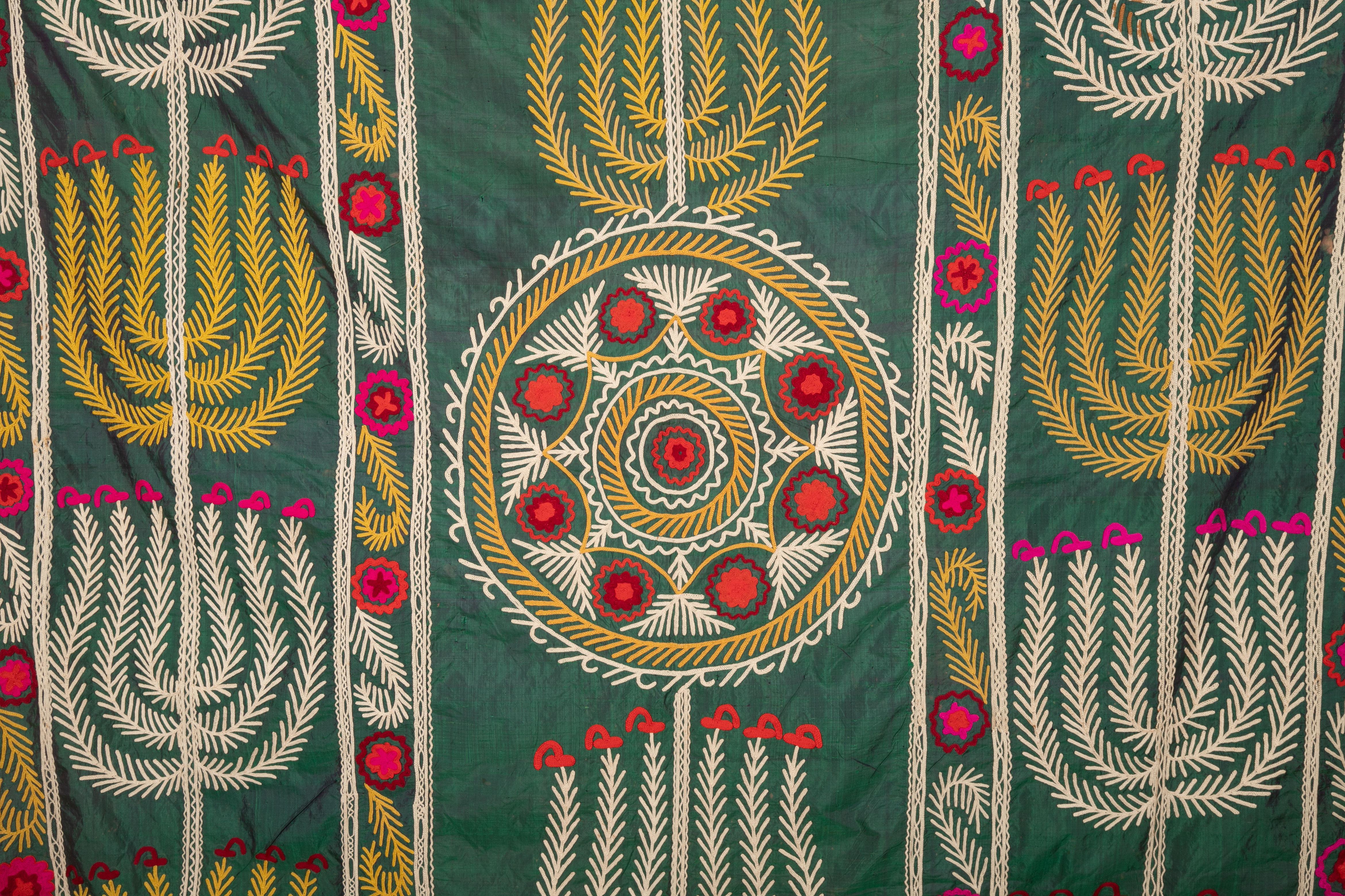 It is silk embroidery on a silk background.