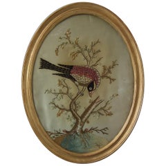 broderie ancienne d'un oiseau dans un arbre