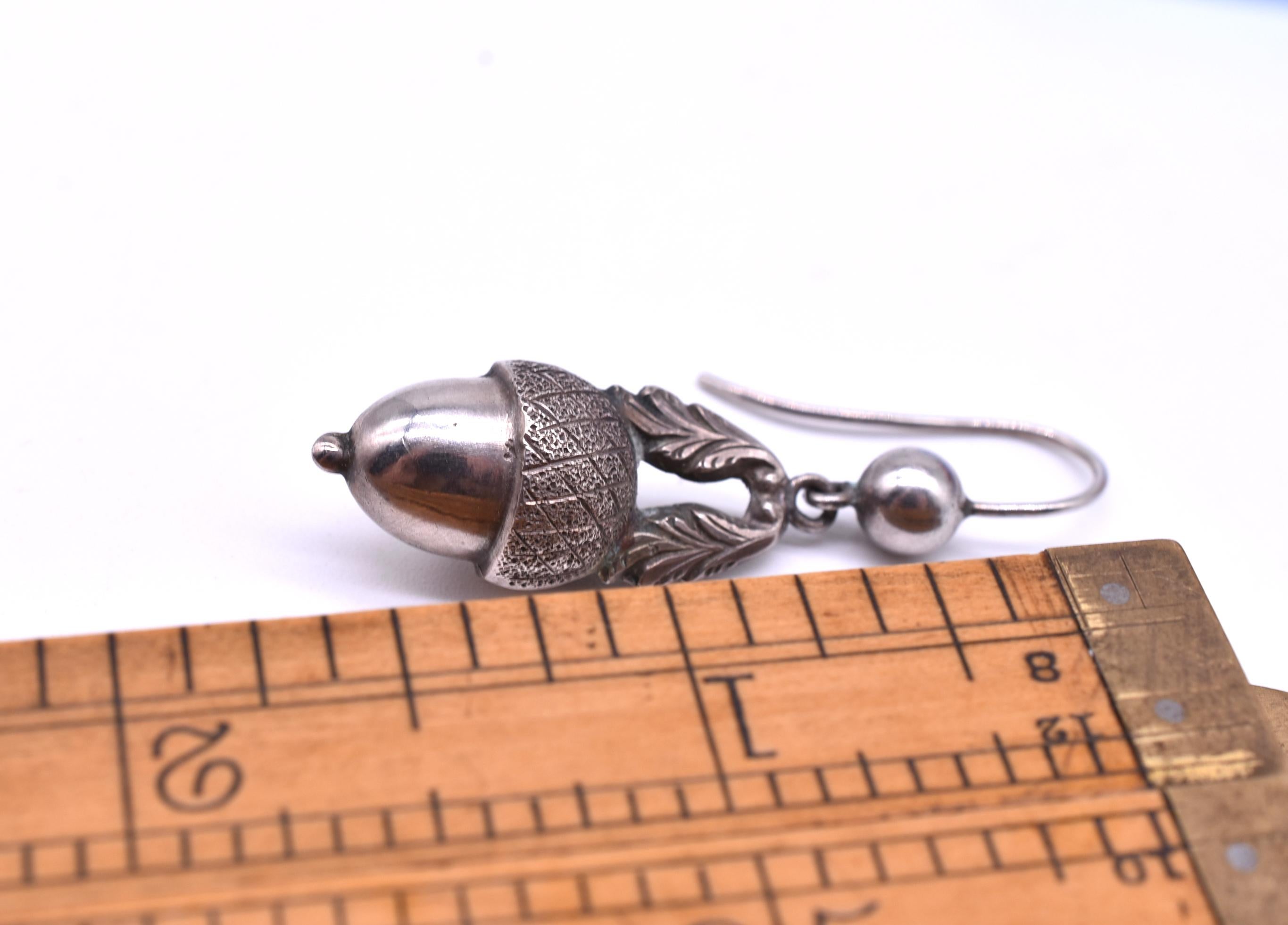 Lovely pair of C1880 sterling silver acorn earrings, approximately 
1 1/2 long by 1/2 inches wide with the  texture of the acorn tops clearly visible as well as the charming acorn leaves.  A symbol of strength and fertility, acorns have long been a
