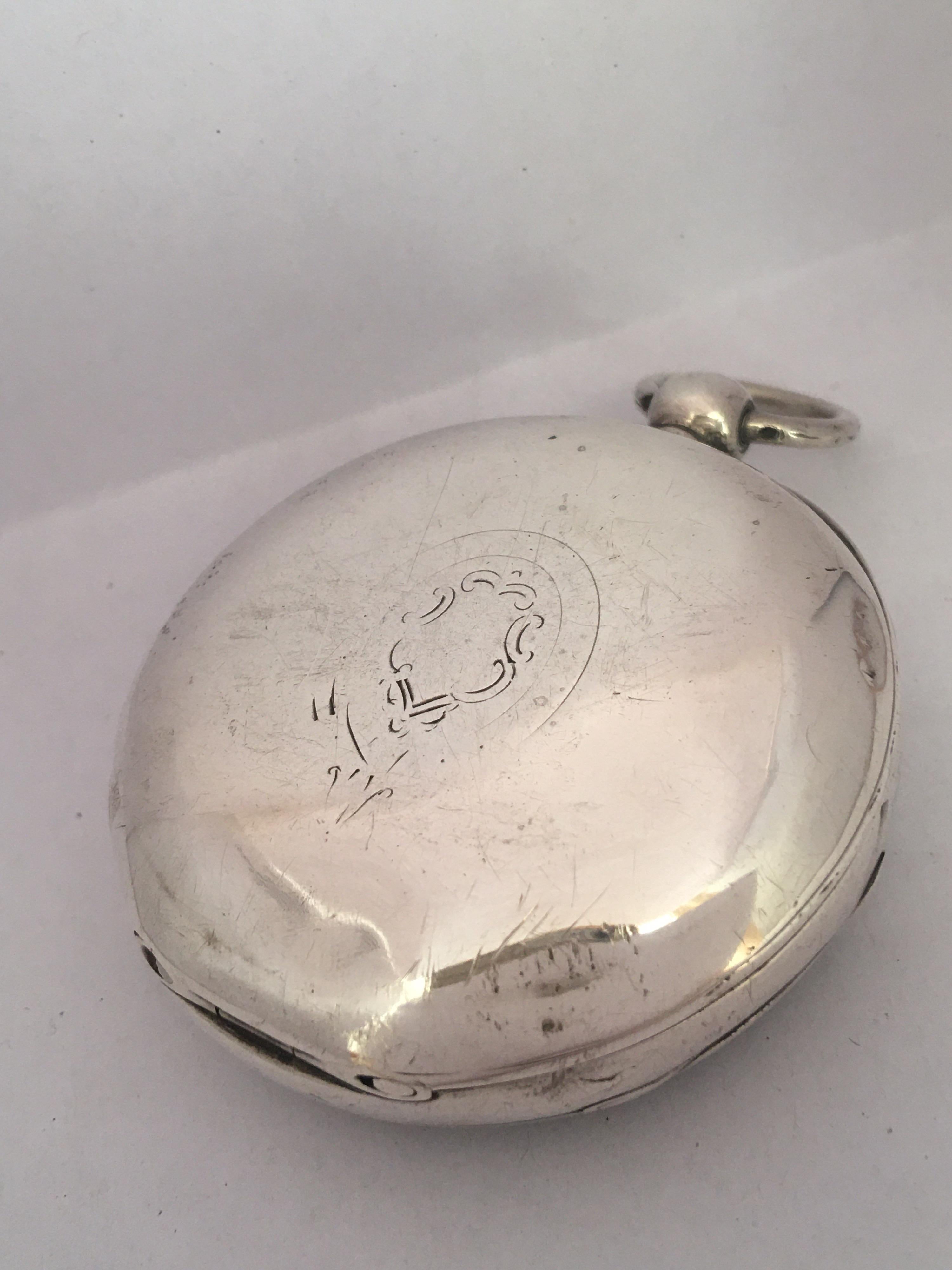 This beautiful antique 57mm diameter key-winding silver pocket watch is in good working order and it is running well. Visible signs of ageing and wear with small light surface marks on the glass and on the watch case as shown. Some dents and bruises