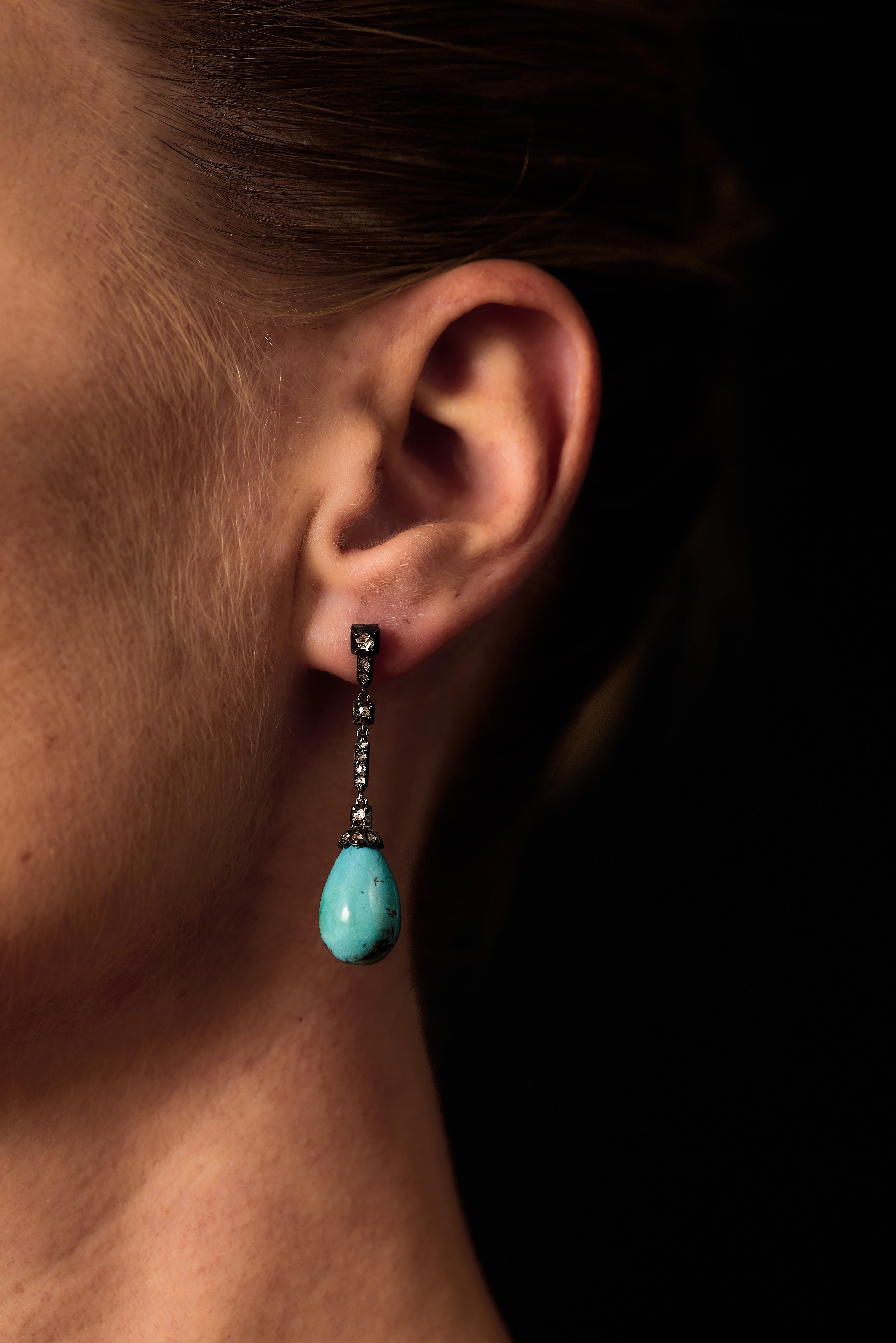 Antique Silver and 18K Gold Earrings with Turquoise Drops and Rose-Cut Diamonds.

Late 19th / Early 20th Century, Victorian Era.

A delicate and elegant pair of antique earrings, crafted in silver and 18K gold. Each earring features a vibrant