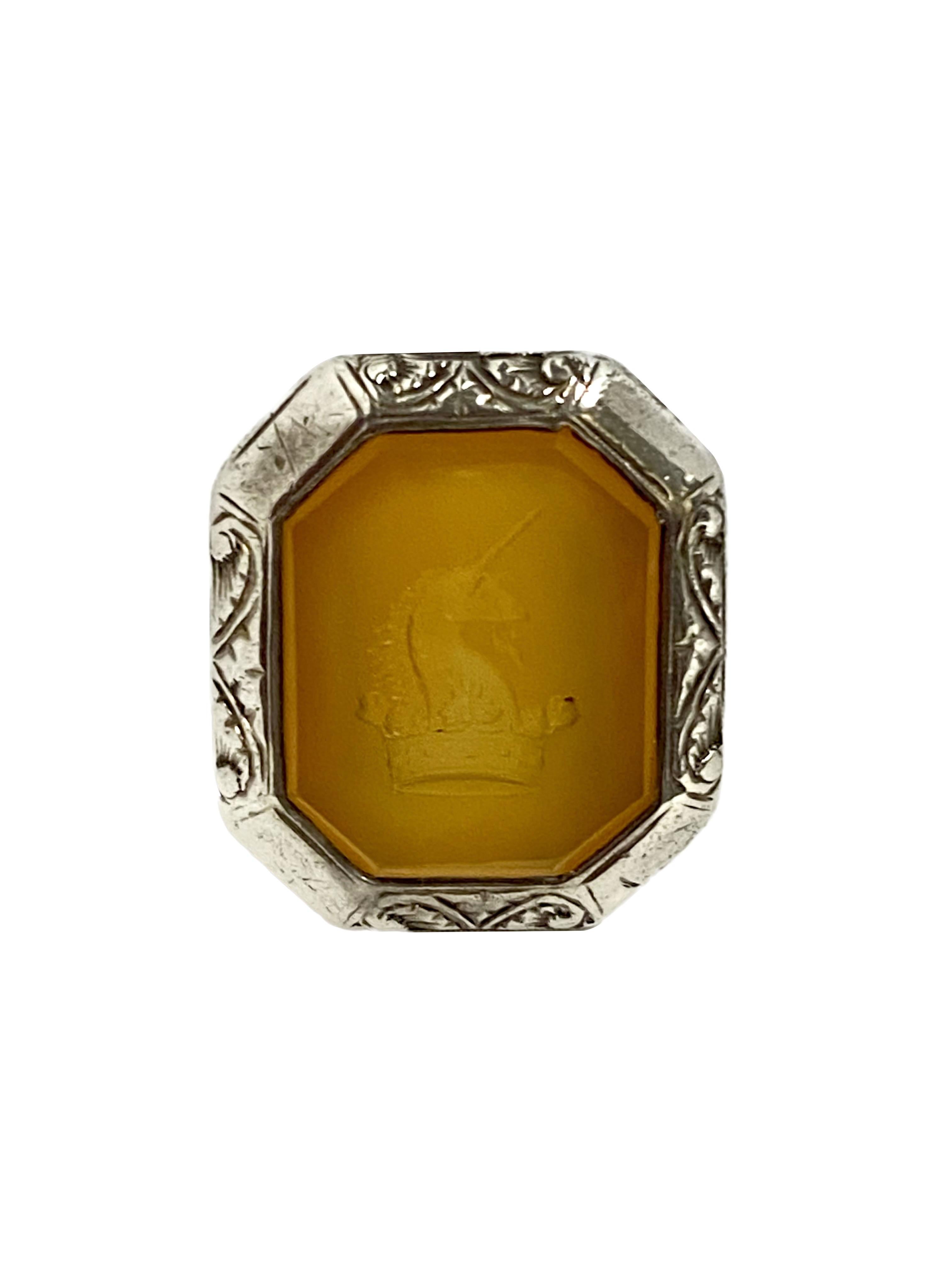 Circa 1880 -1890 large Sterling Silver Signet Ring, the top measures 1 x 3/4 inch and is set with a Light Orange Brown Beveled edge Agate with carved Crest. finger size 9 3/4. Nice Thick Heavy construction.